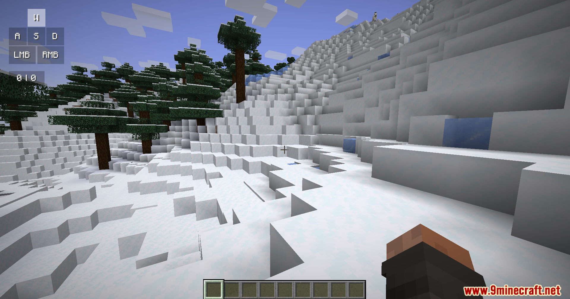 A snowy mountain landscape in Minecraft with a keystrokes overlay