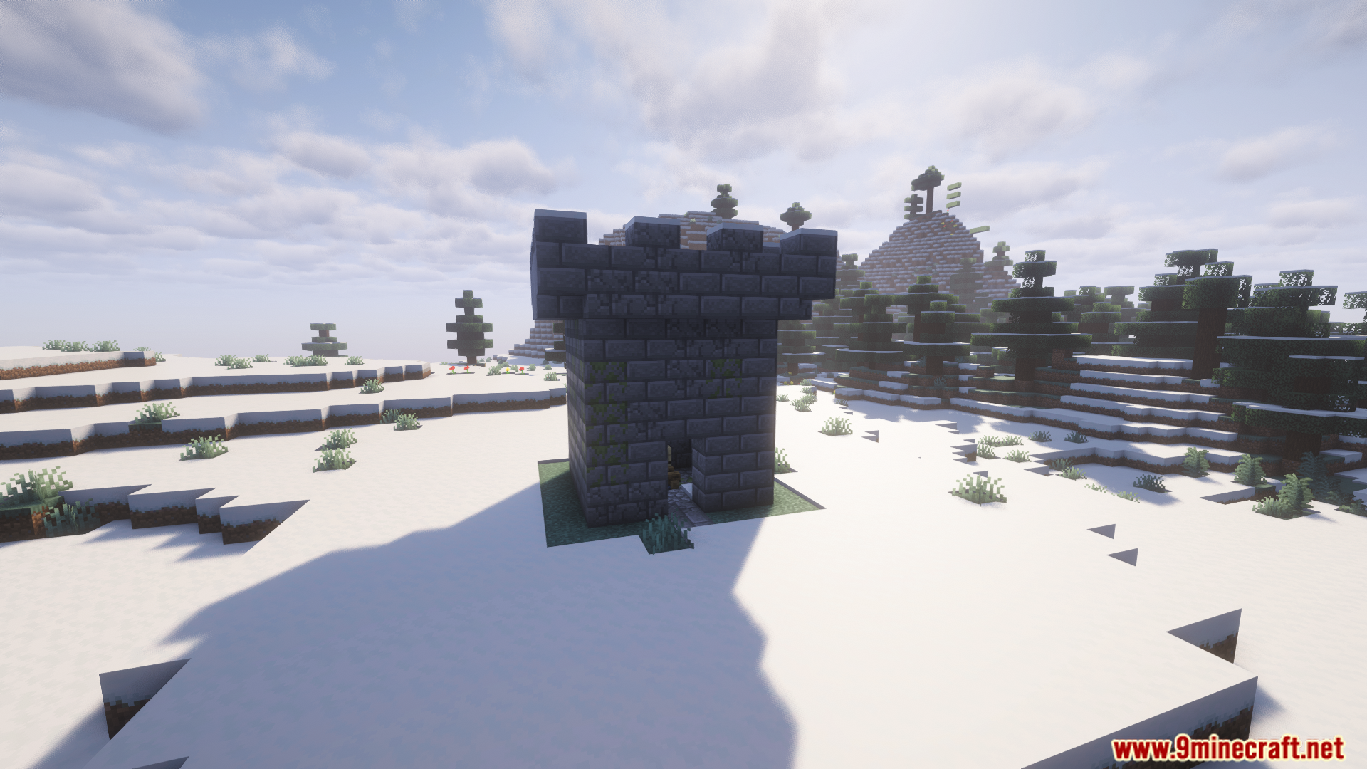 A dark stone tower structure in a snowy biome