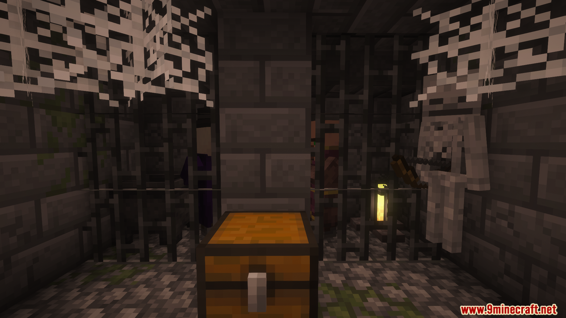 A dark dungeon with prison cells and a chest