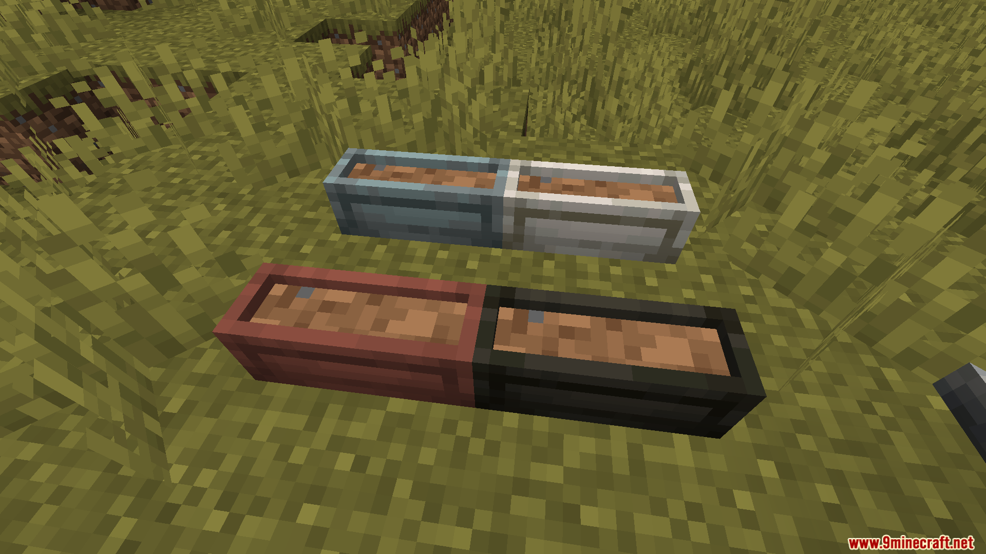 Lilis Pottery Mod Screenshot 5 Four different colored rectangular ceramic planters filled with dirt on grass