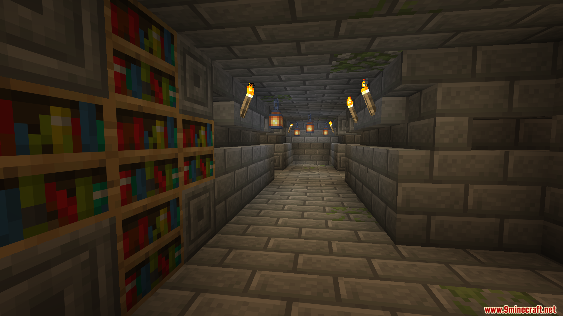 Underground stone brick hallway with bookshelves and torches