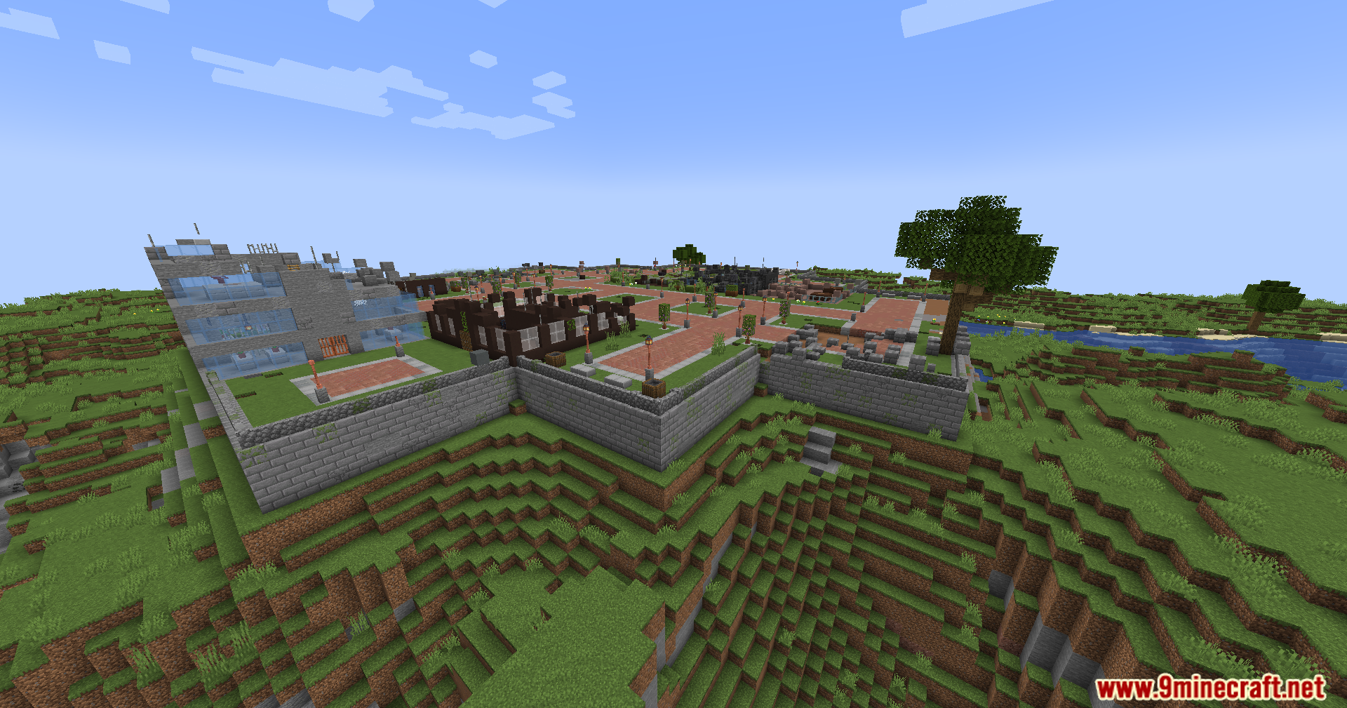 A walled city built on a grassy, rolling hill
