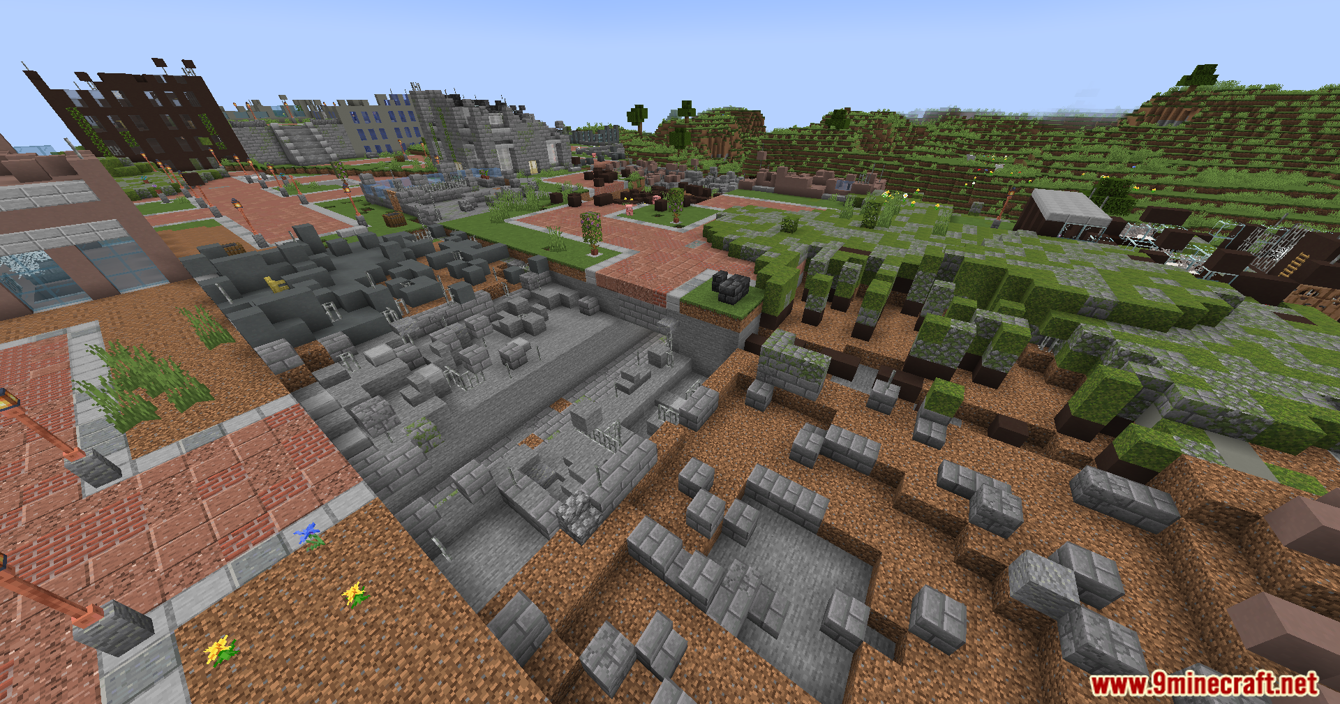 A large crater filled with rubble in a destroyed city