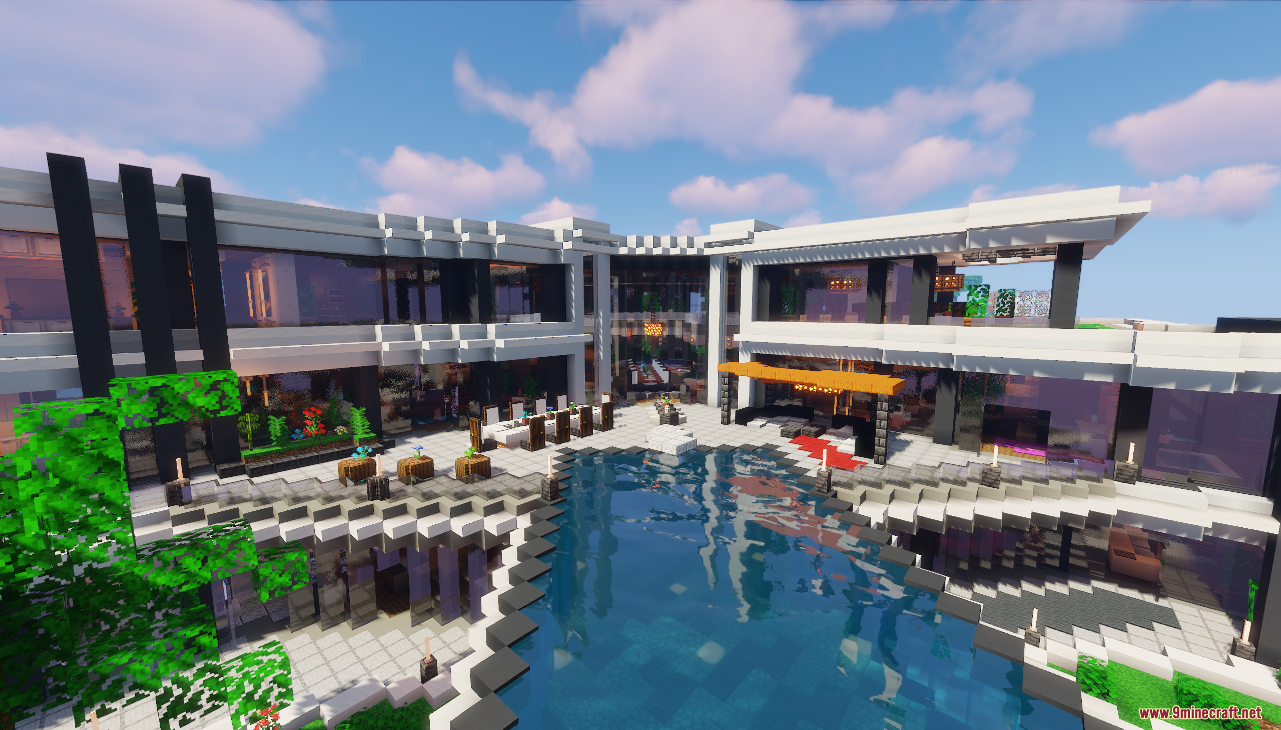 A modern mansion with a large swimming pool and patio