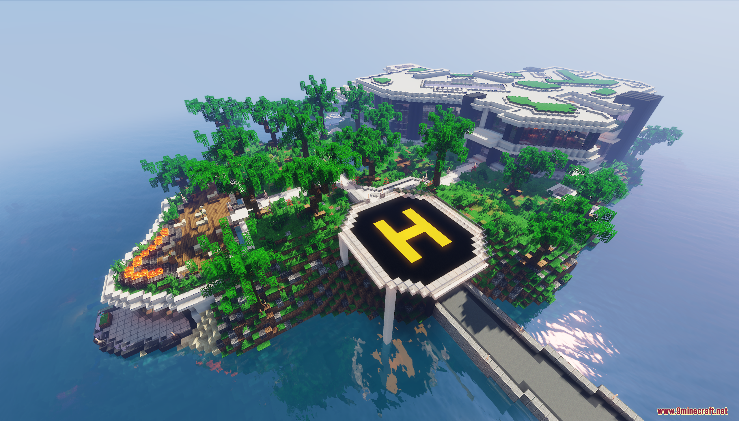 An aerial view of a private island with a helipad