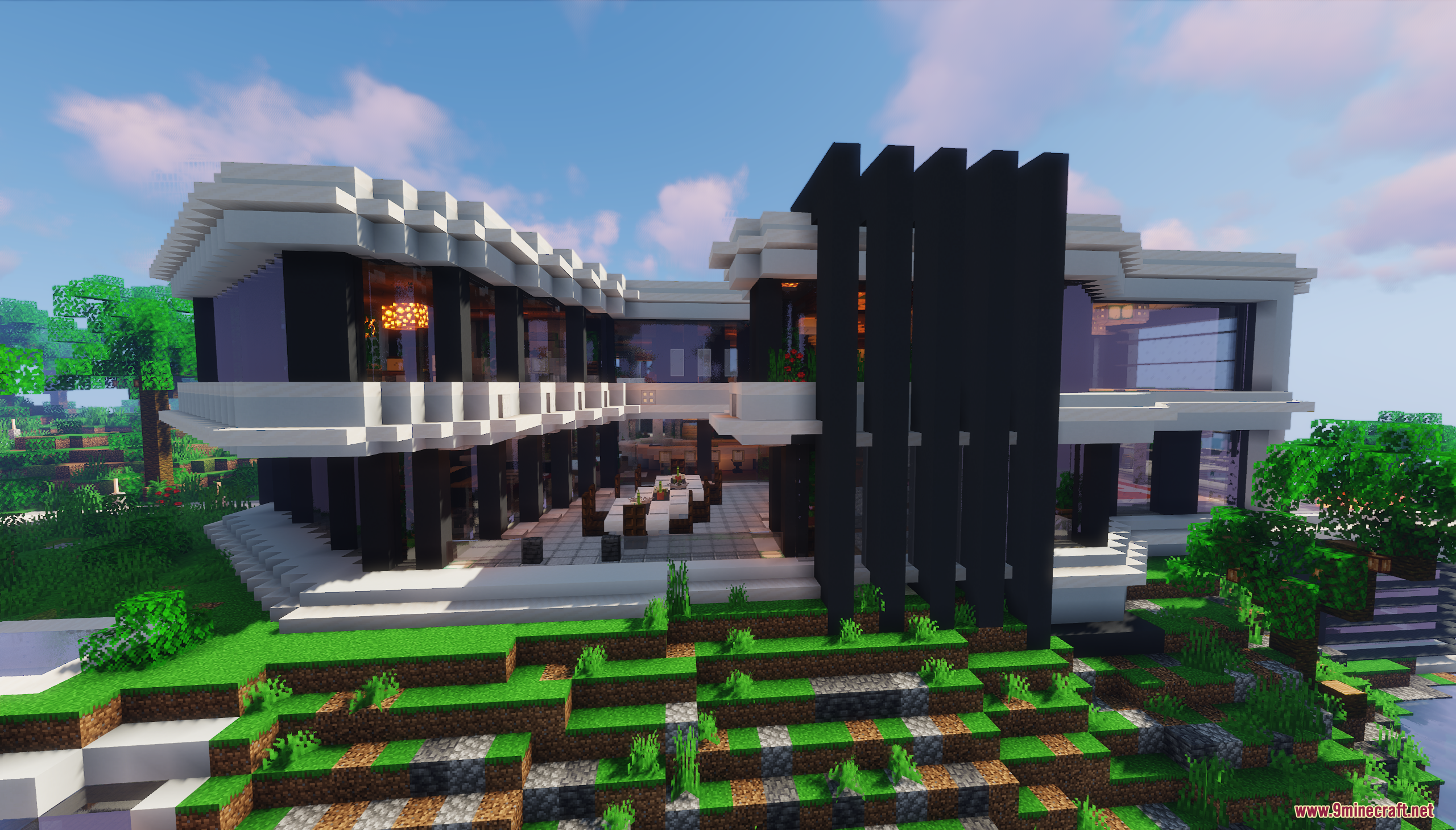 A large modern mansion built on a terraced green hill