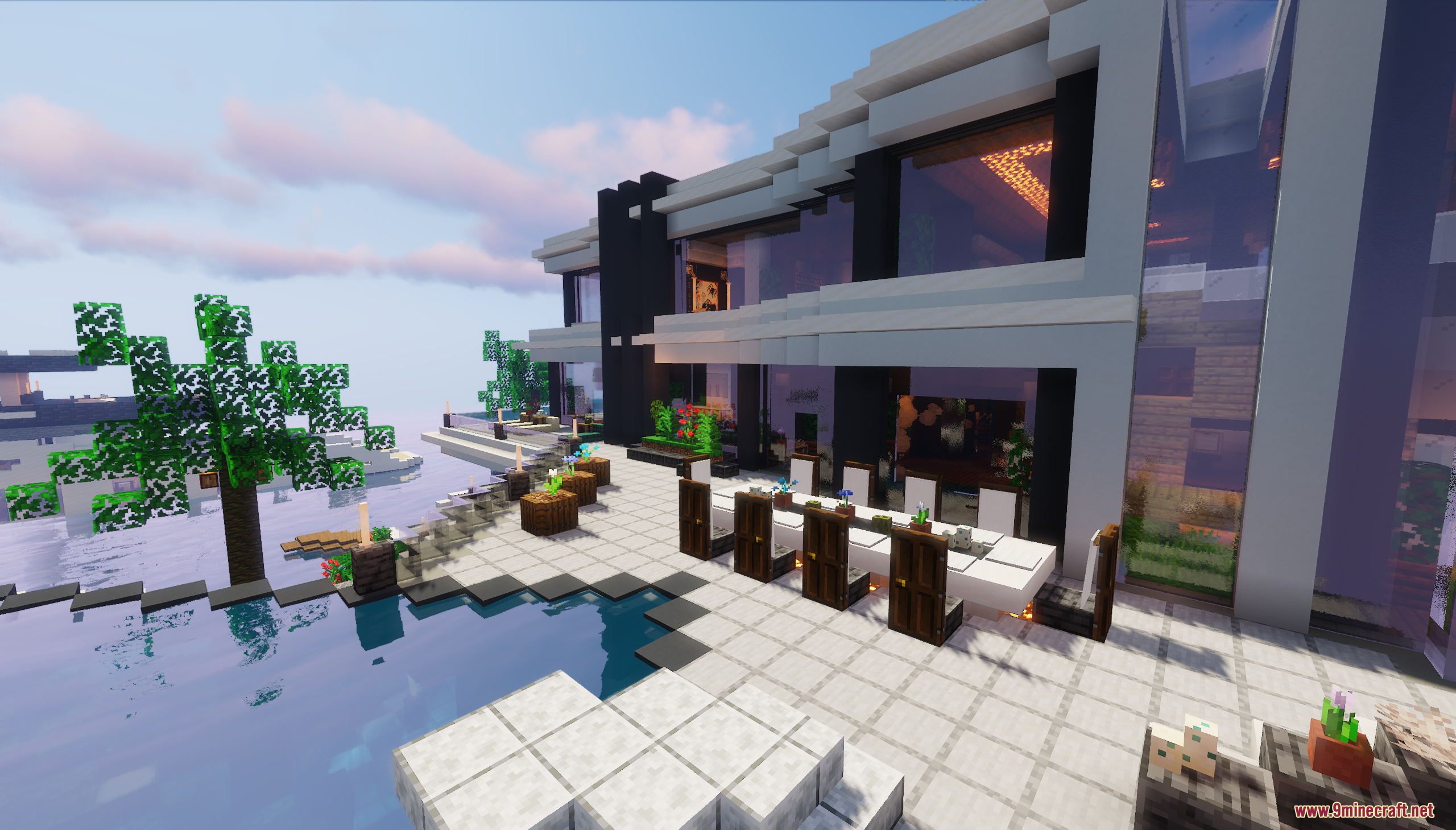 A modern mansion patio with a pool and outdoor dining area