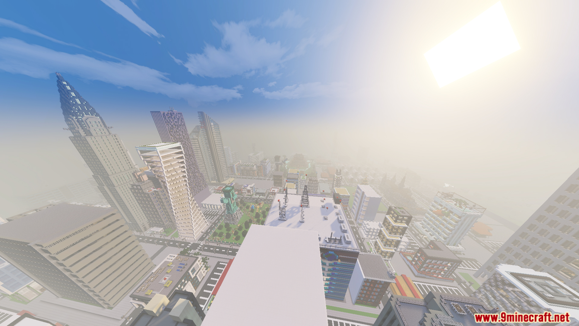 Looking down at a city skyline with a tall pointed skyscraper