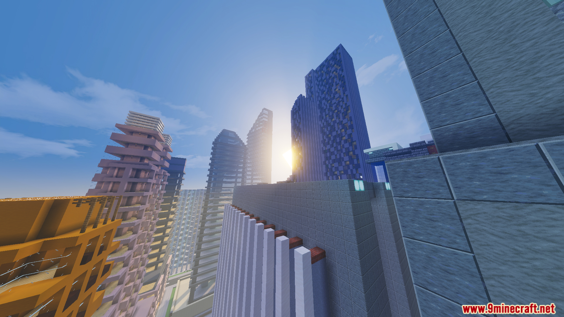 Sun setting behind tall buildings in a city map