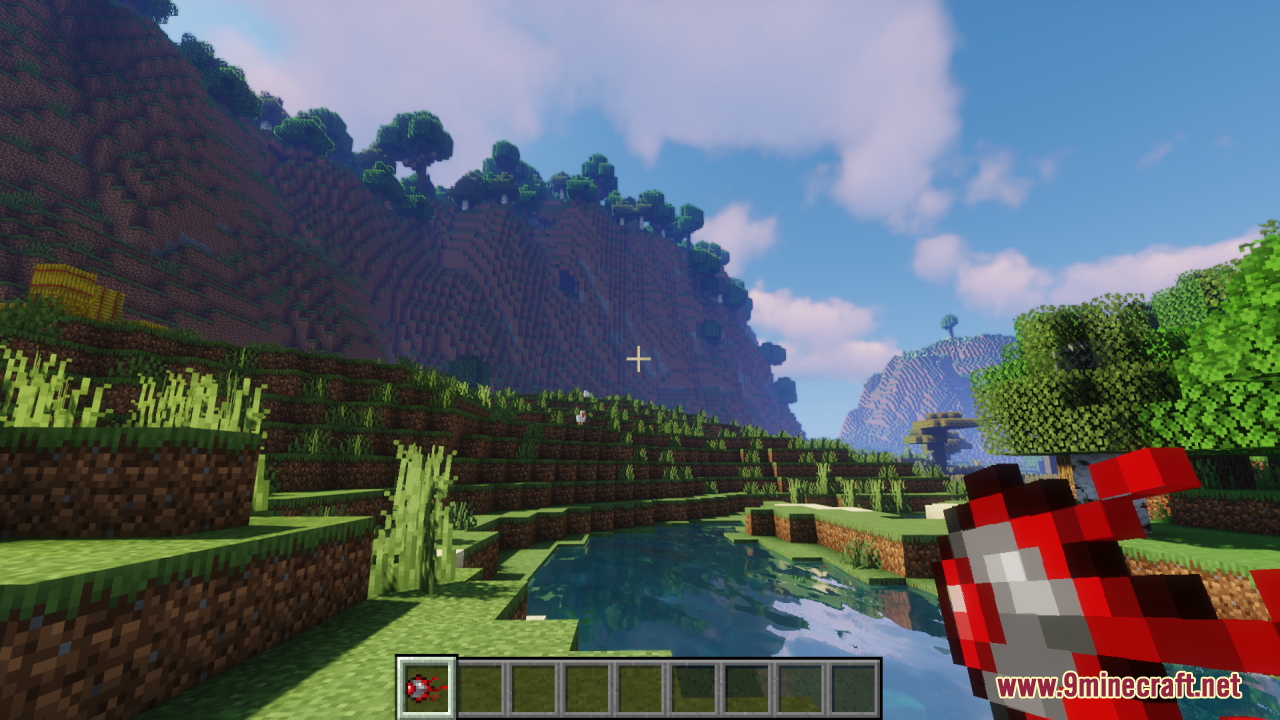 Mechanical Eye Resource Pack Screenshot 8 Player holding the Mechanical Eye item in a grassy landscape