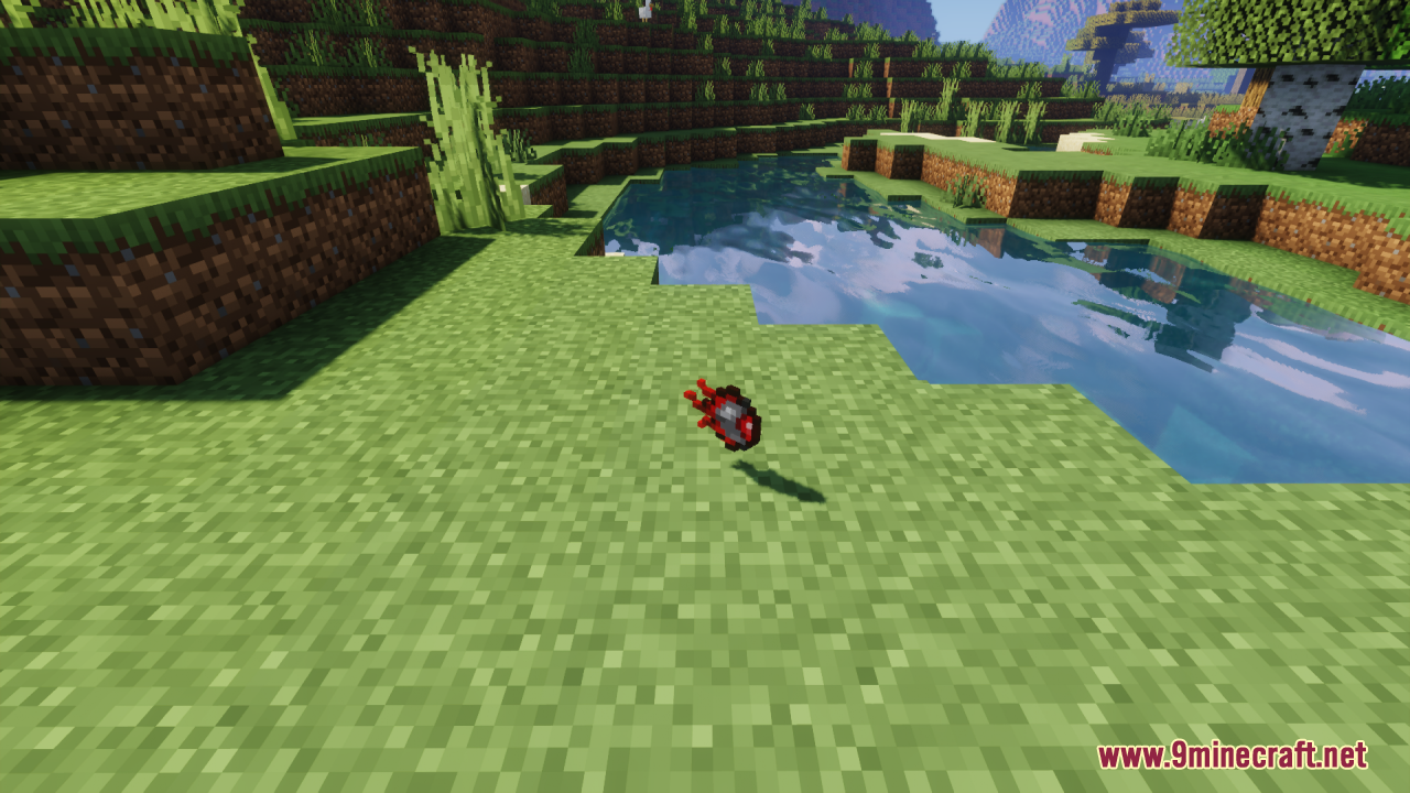 Mechanical Eye Resource Pack Screenshot 9 A dropped mechanical eye item lying on the grass near a river