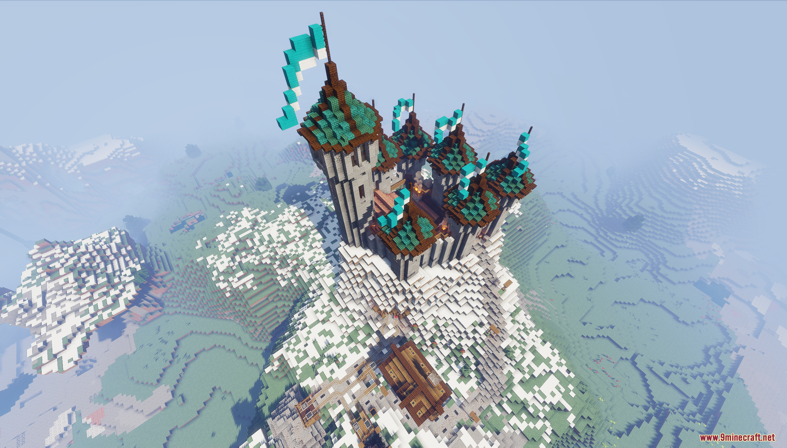 An aerial view of a castle on a snowy mountain peak