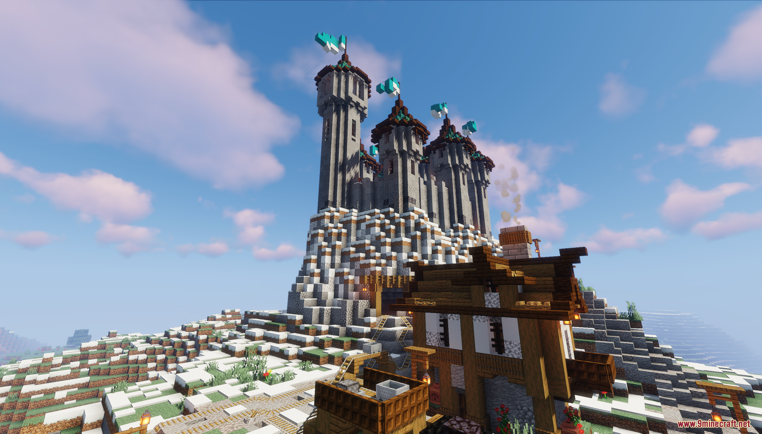 Looking up at the tall stone castle from a village house