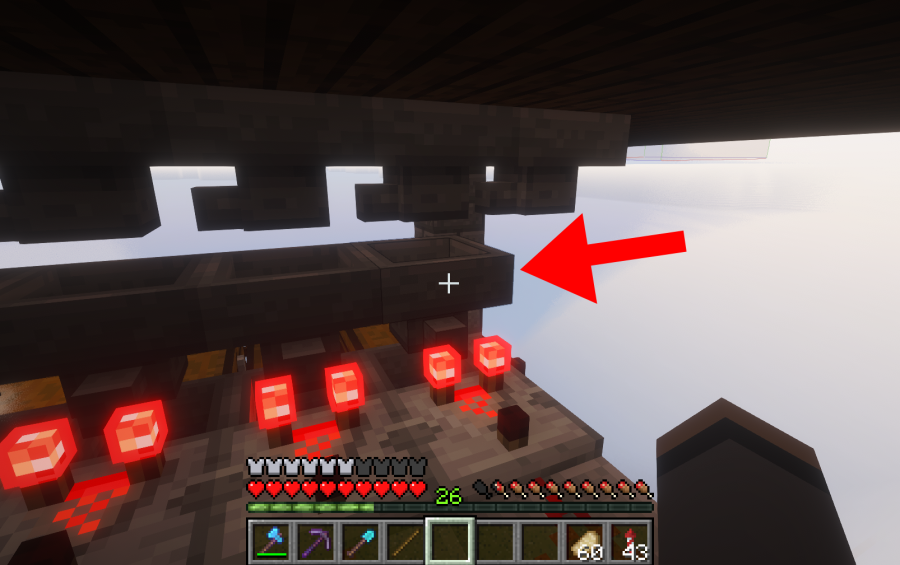 Mega Mob XP Farm Schematic Screenshots 1 Red arrow pointing to a hopper within a redstone item sorting mechanism