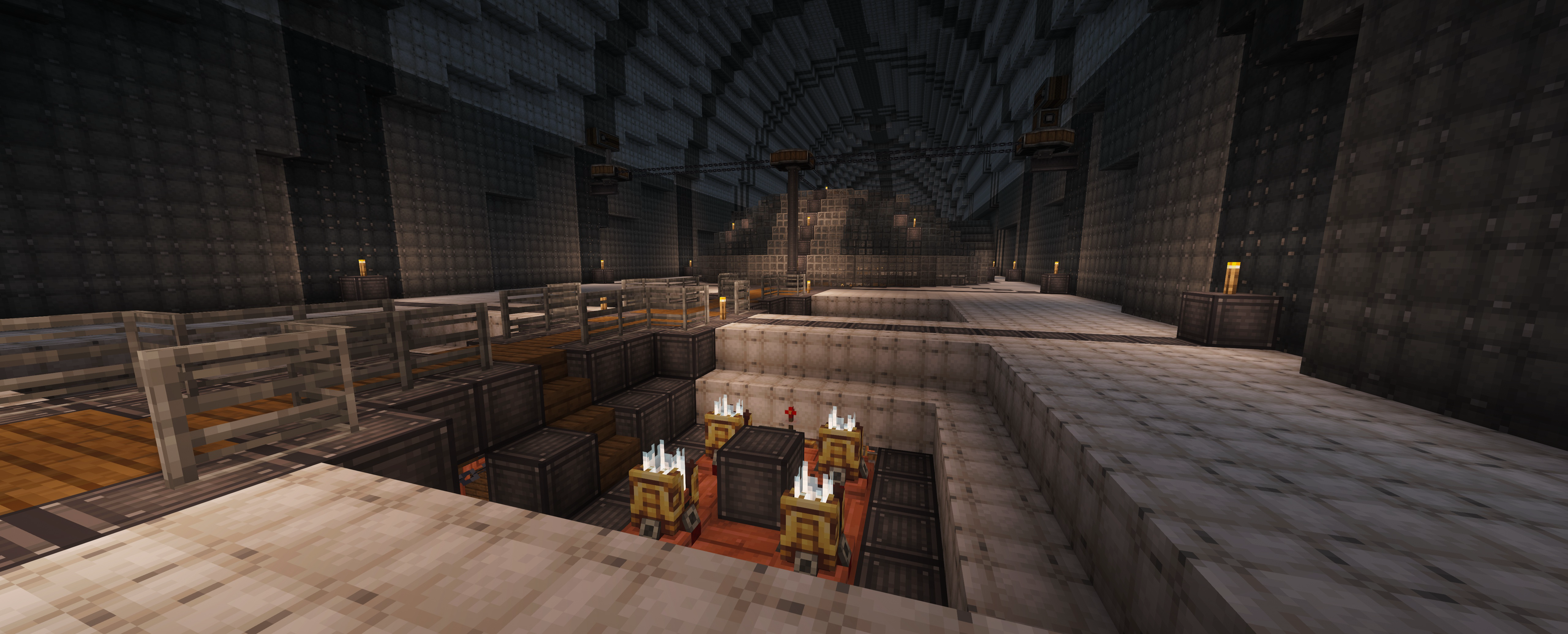 A massive industrial interior features sunken engine components