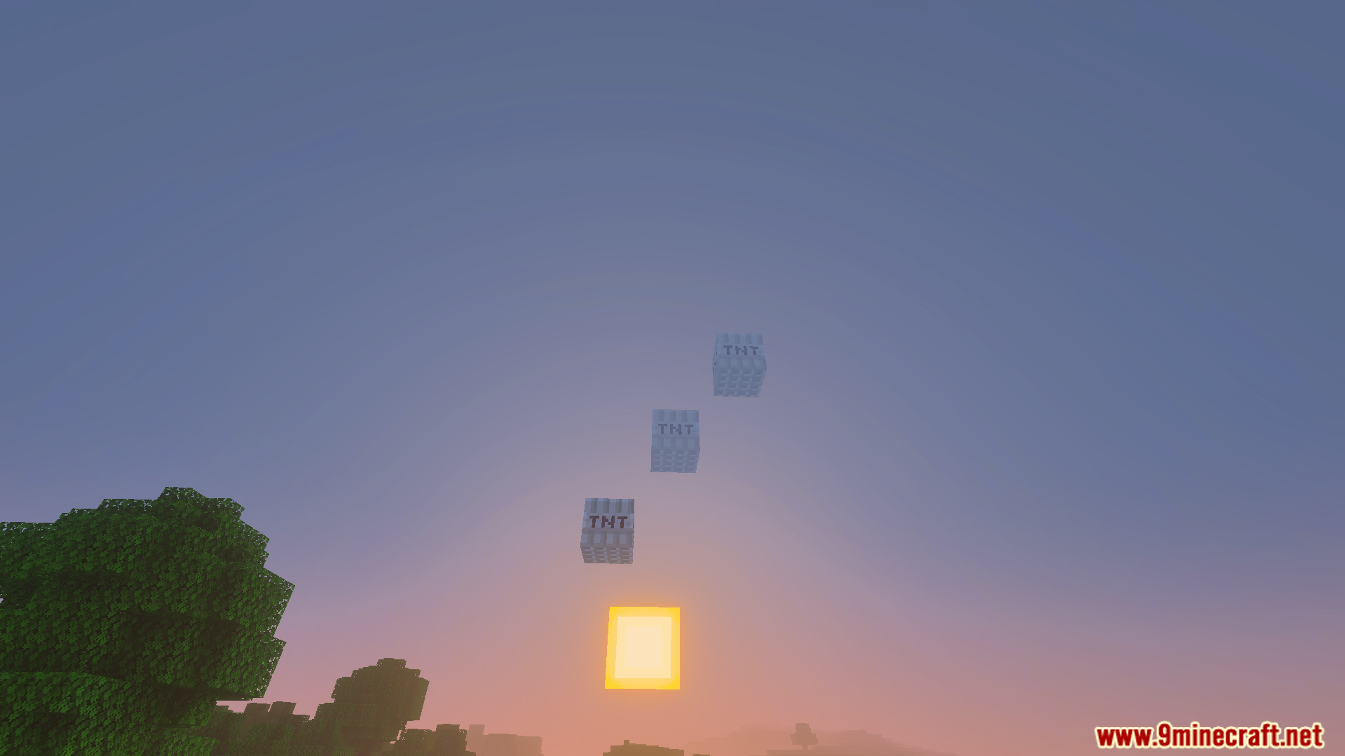 Not Enough TNT Addon Screenshot 5 Three fake explosive blocks floating in the sky at sunset