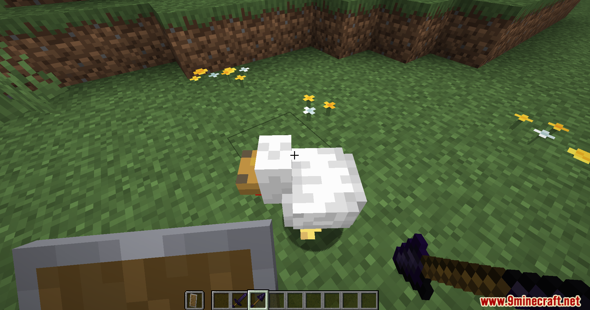 Player aiming an obsidian spear at a white chicken on the grass