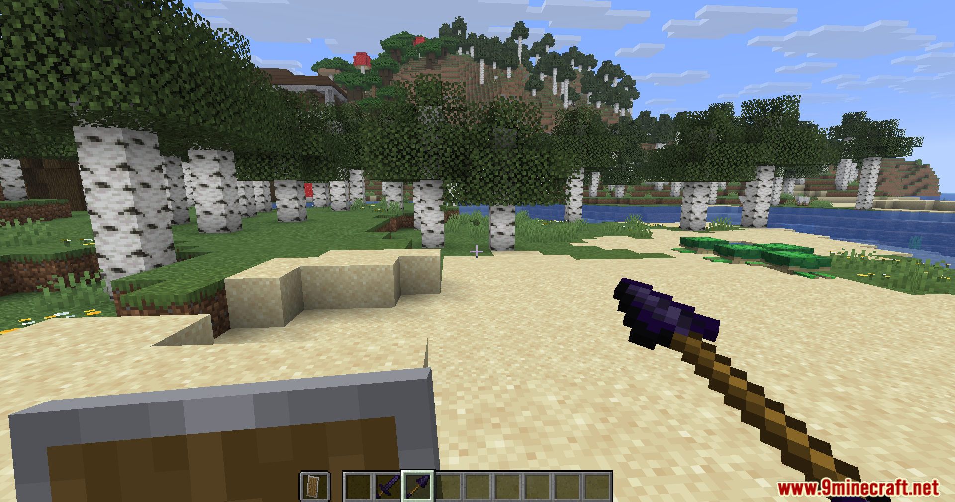Player holding an obsidian spear and shield on a sandy beach