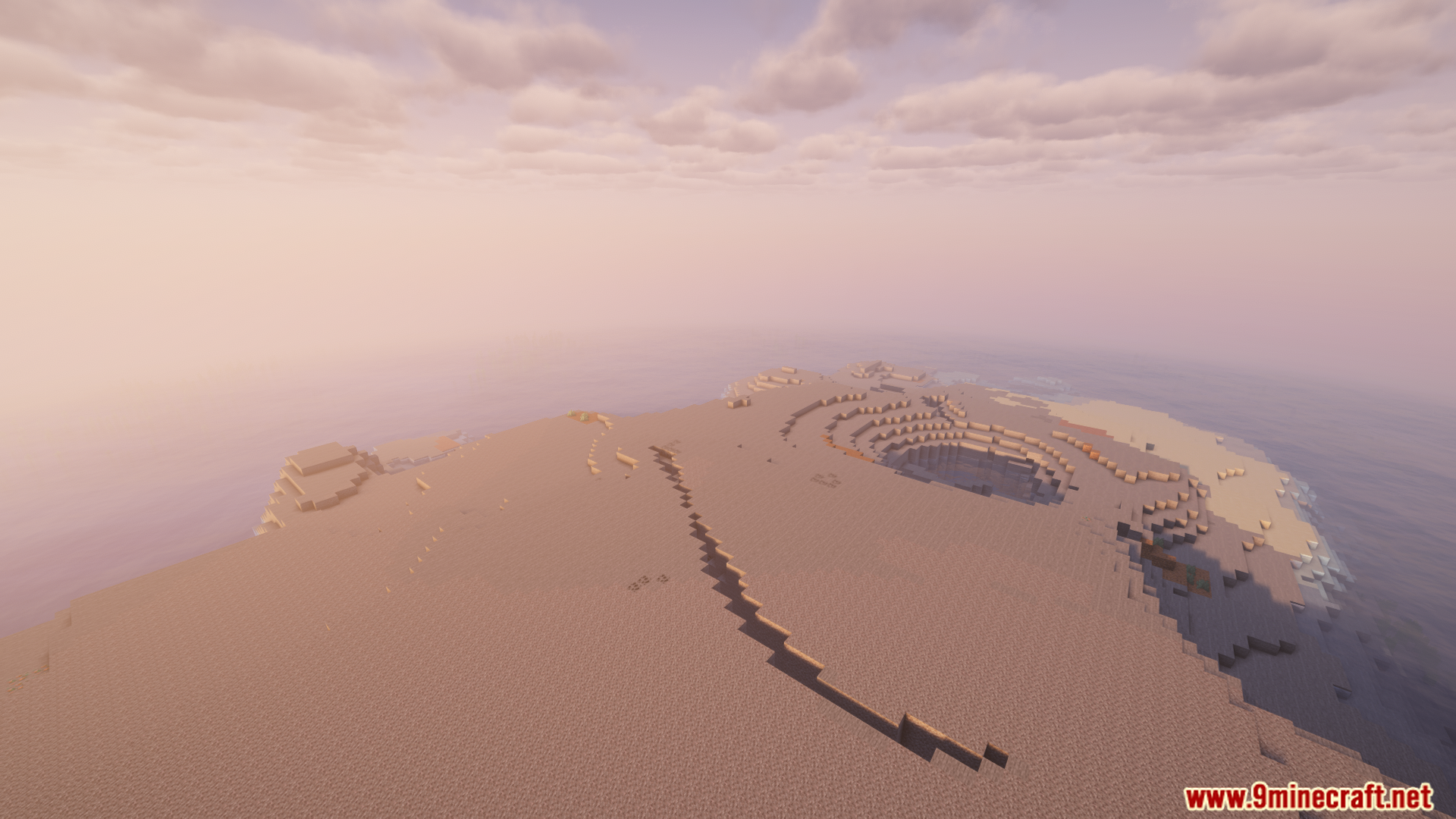 A large sandy island in a vast ocean world
