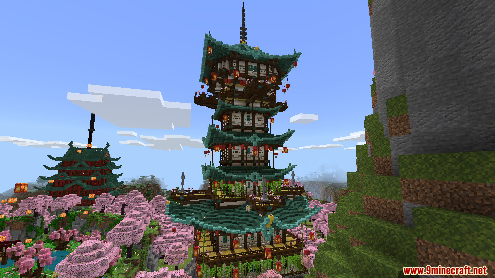 Explore a tall traditional pagoda surrounded by pink cherry trees