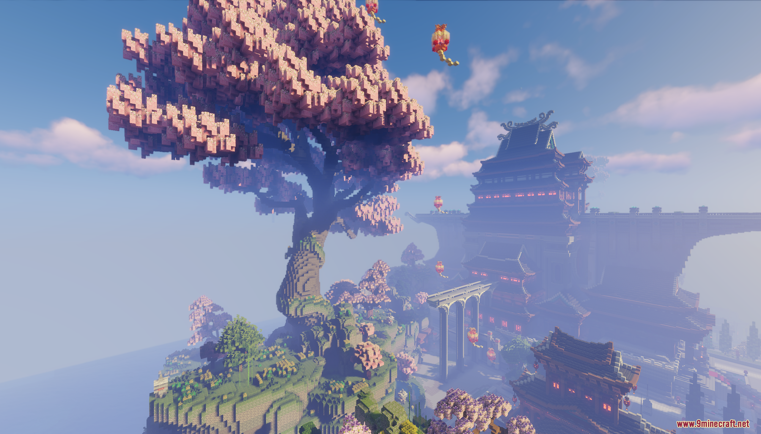 Giant cherry blossom tree overlooking a large Asian style temple complex with lanterns