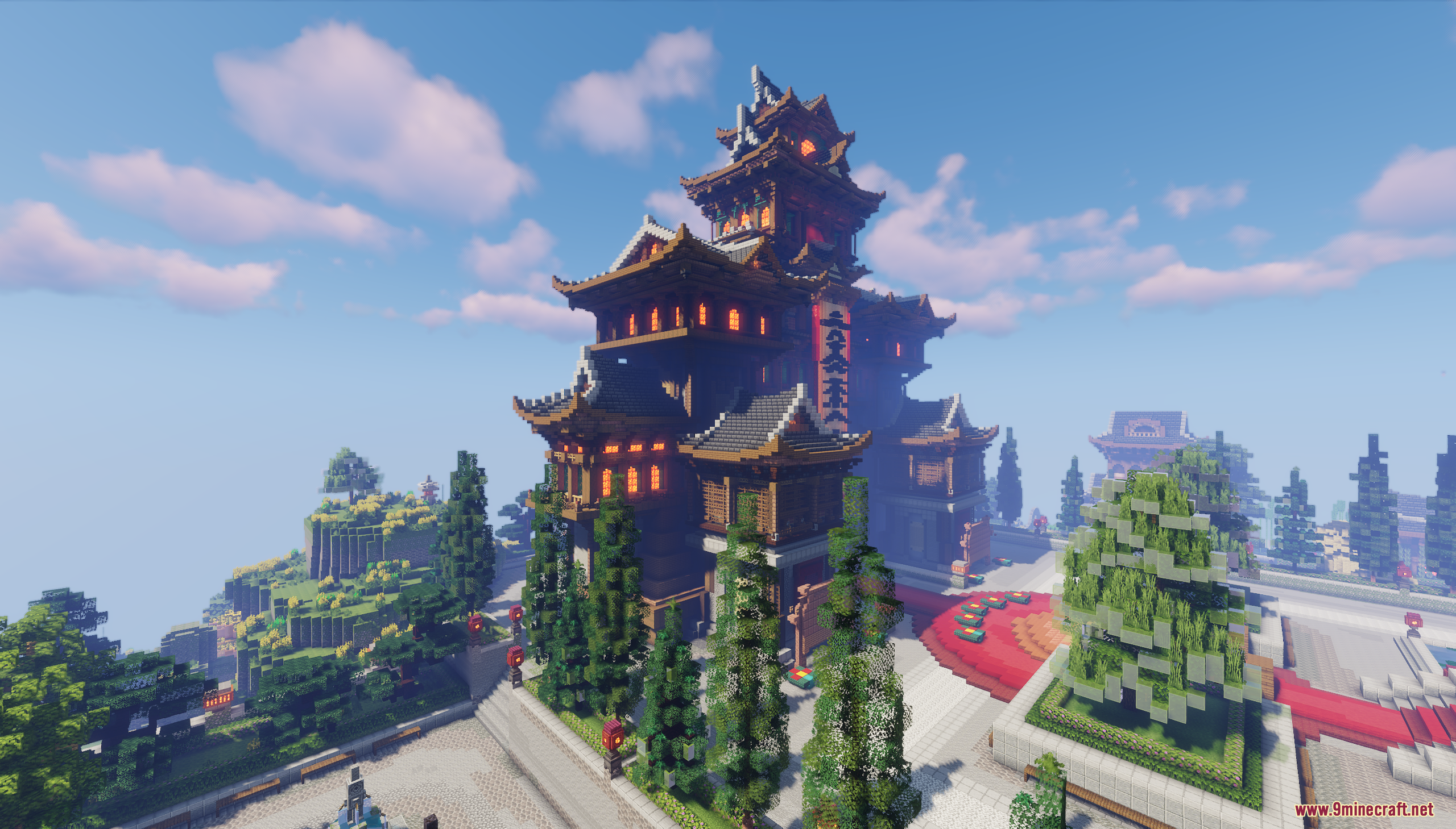 Large multi tiered oriental building with curved roofs and decorative red lanterns