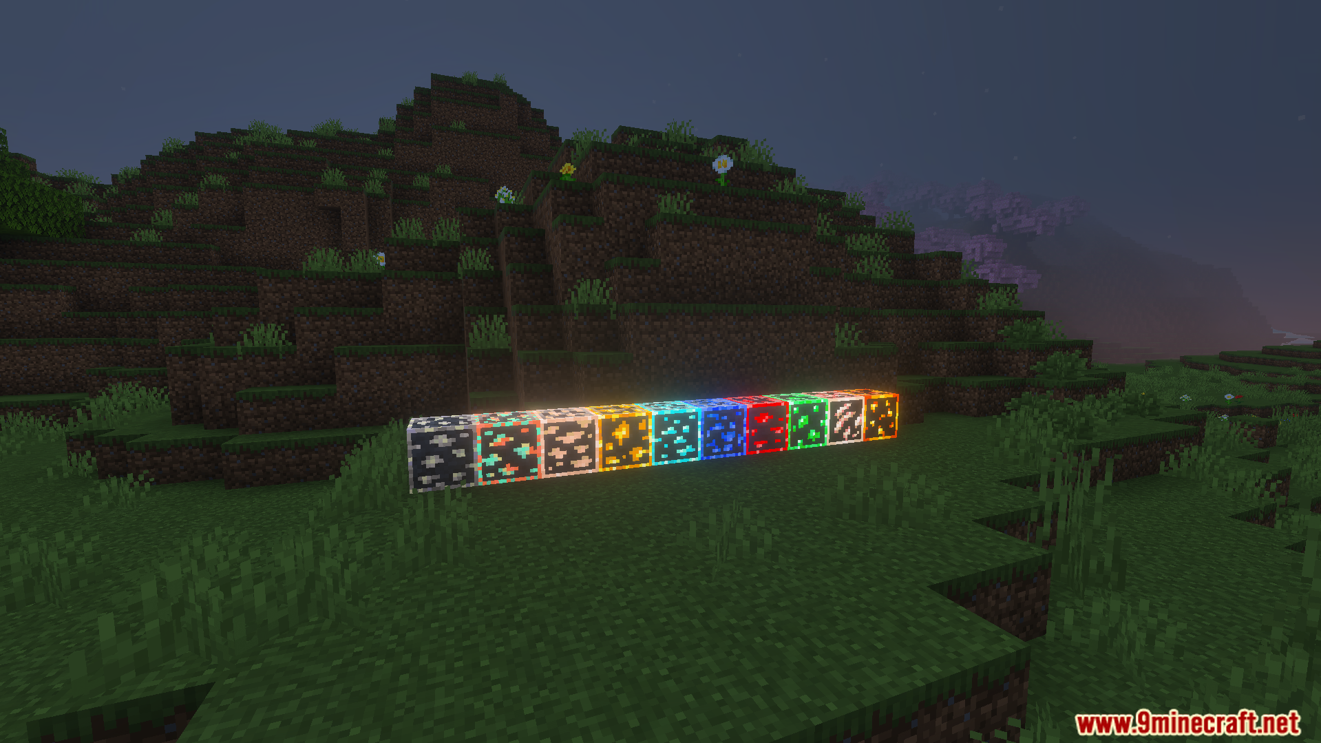 Row of different ore blocks shining brightly with glowing outlines at night