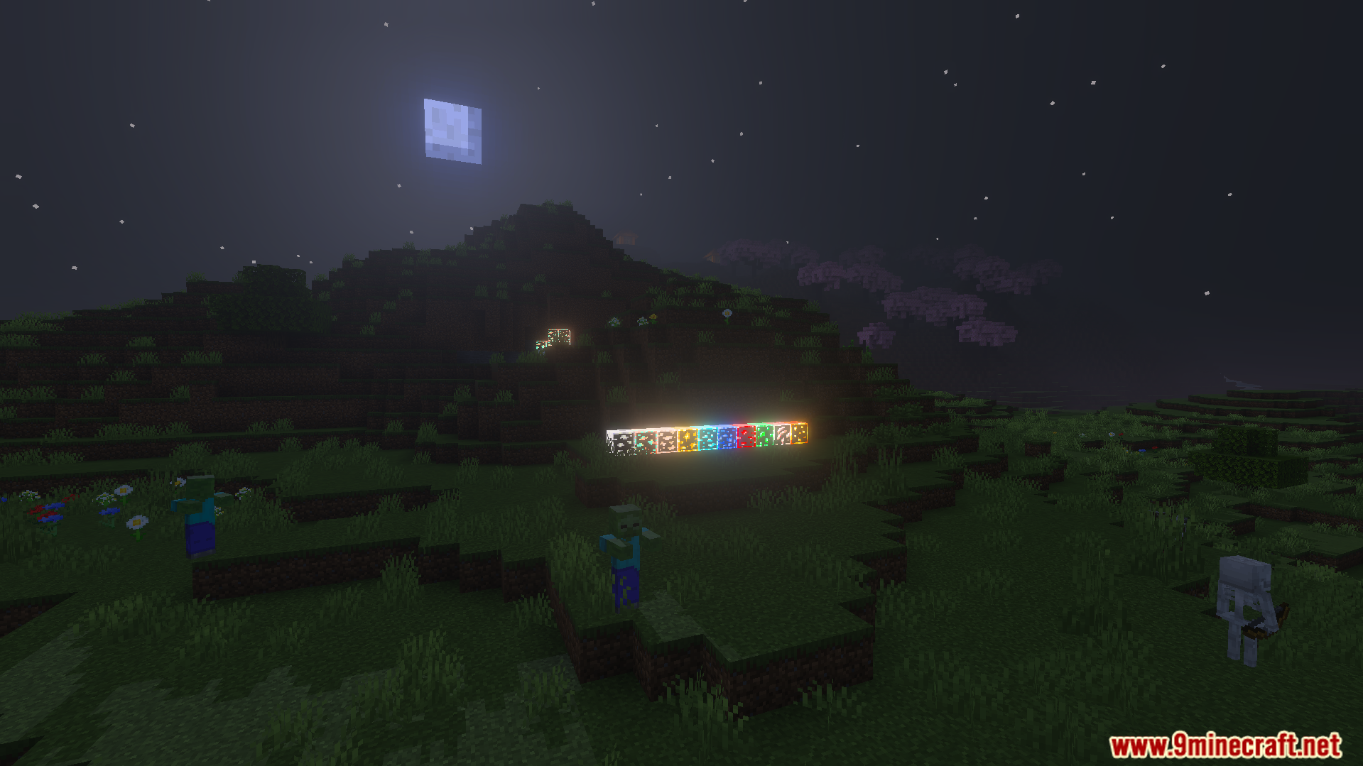 Various types of glowing ores placed outside at night near mobs