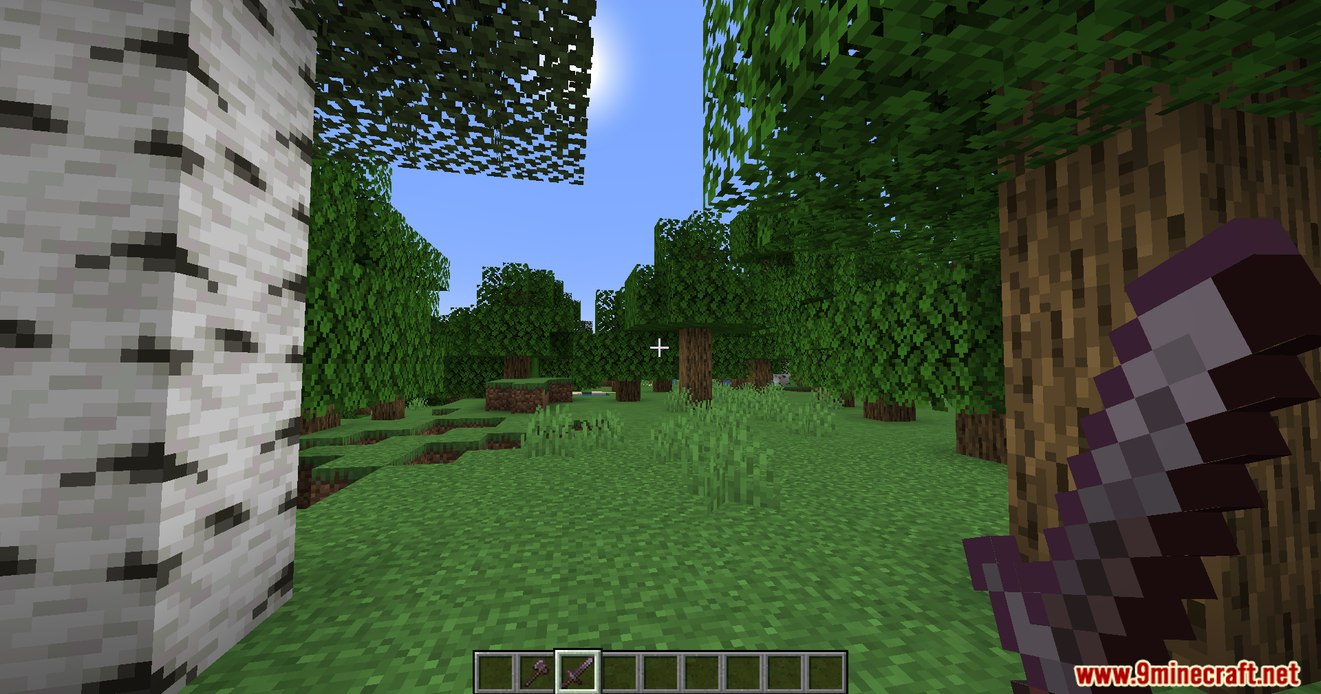 PVP Optimizer Mod Screenshot 9 Player stands in a forest, holding a purple weapon, looking at trees