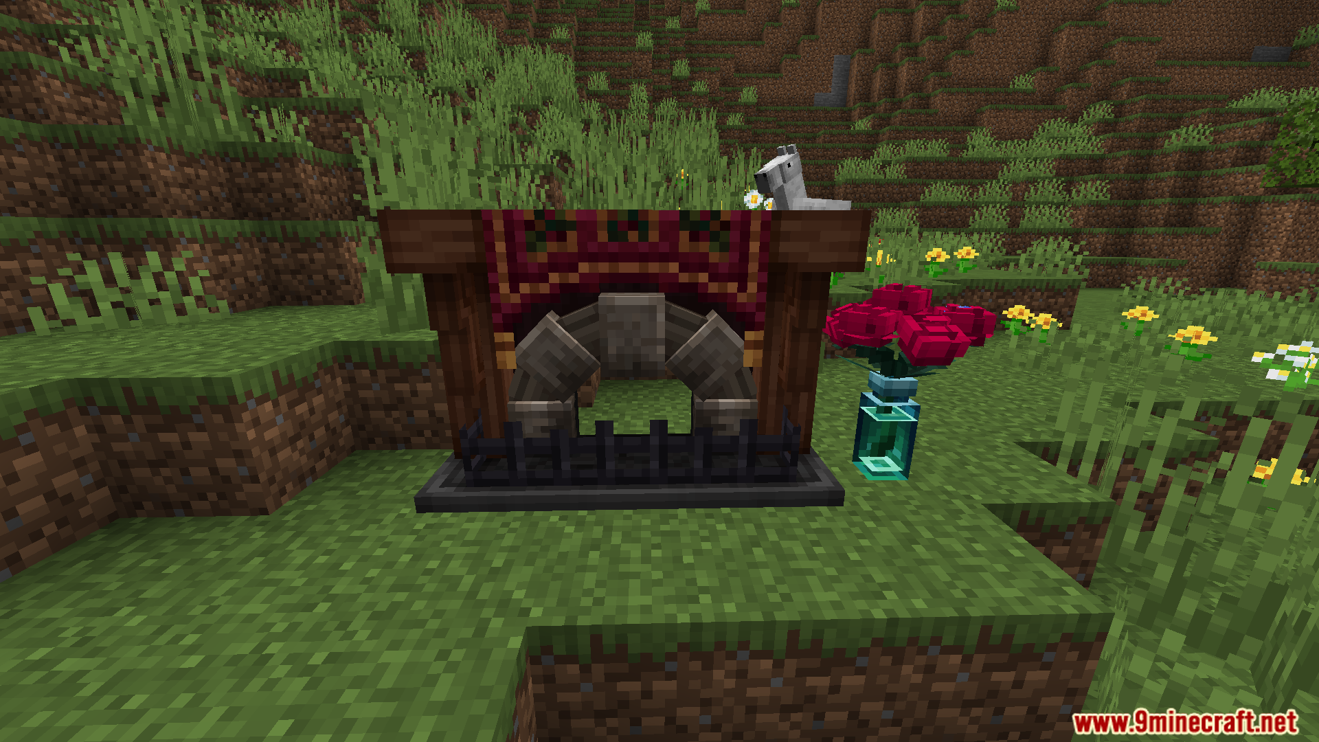 A decorative vintage fireplace with a tapestry and flowers