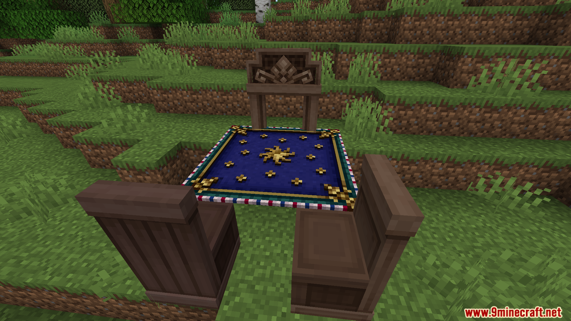 A small table with a decorative blue star tablecloth