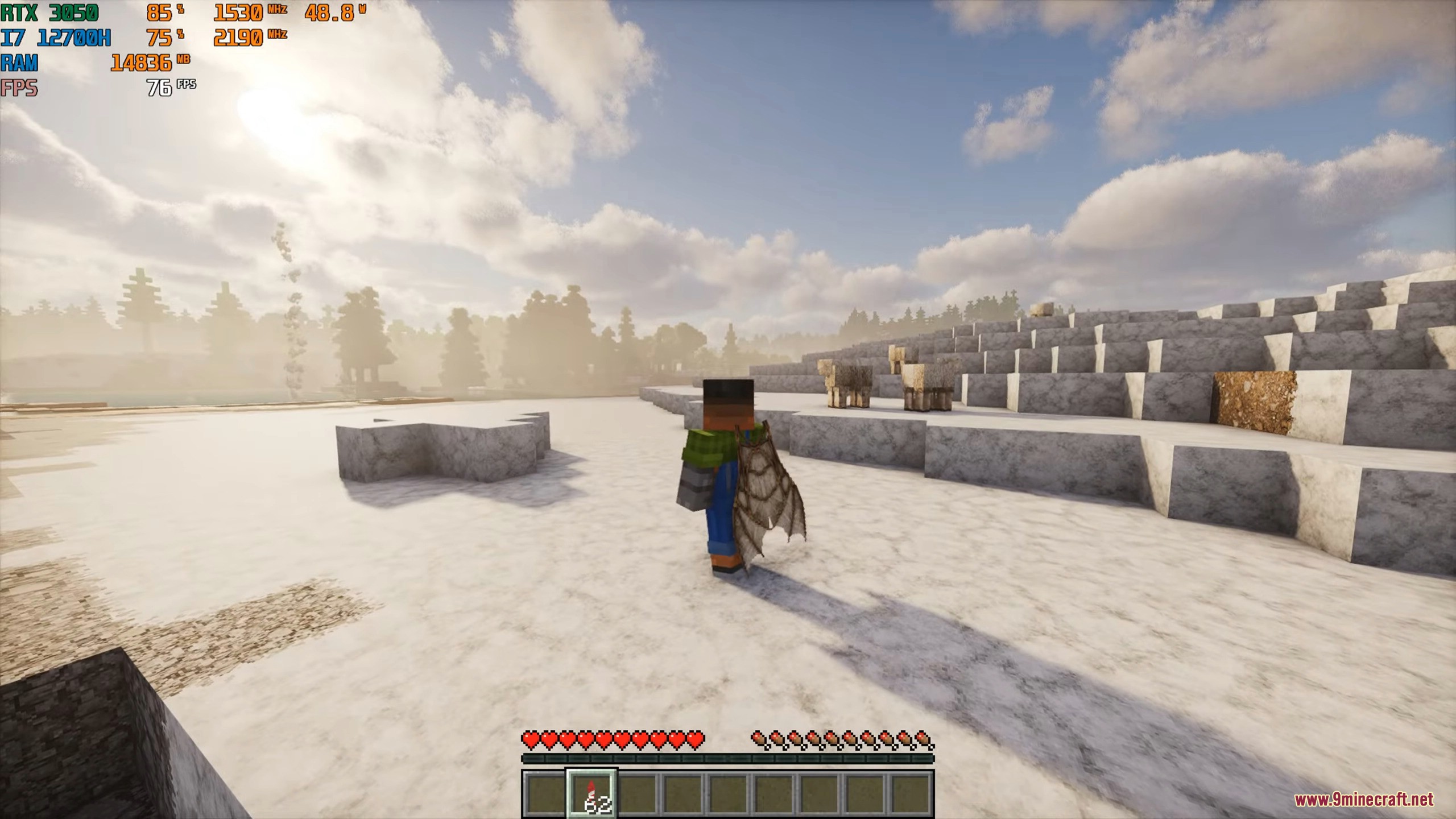 Character wearing elytra standing on detailed snowy terrain near a group of sheep
