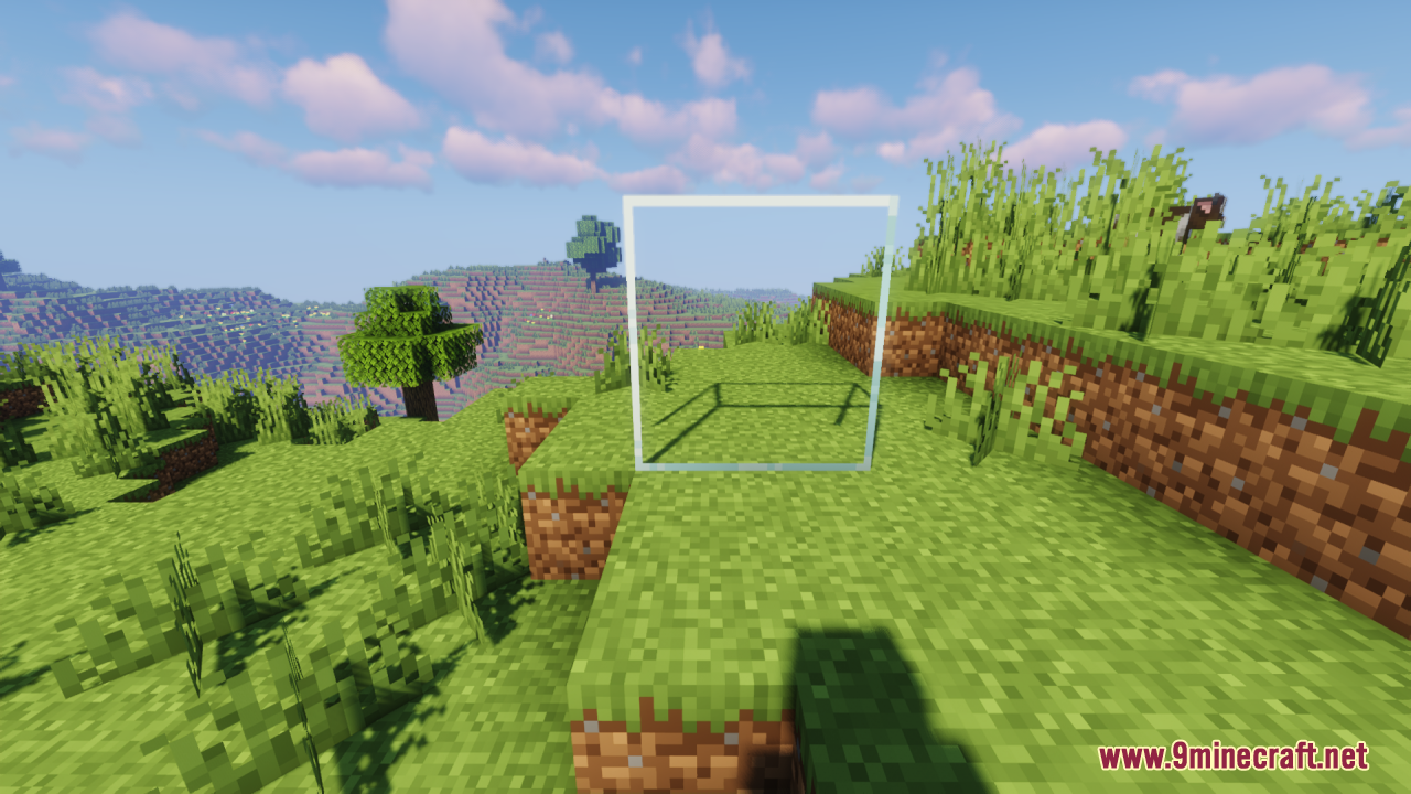 Perfect Clear Glass Resource Pack Screenshot 1 A completely transparent glass block placed on a grassy hill in Minecraft