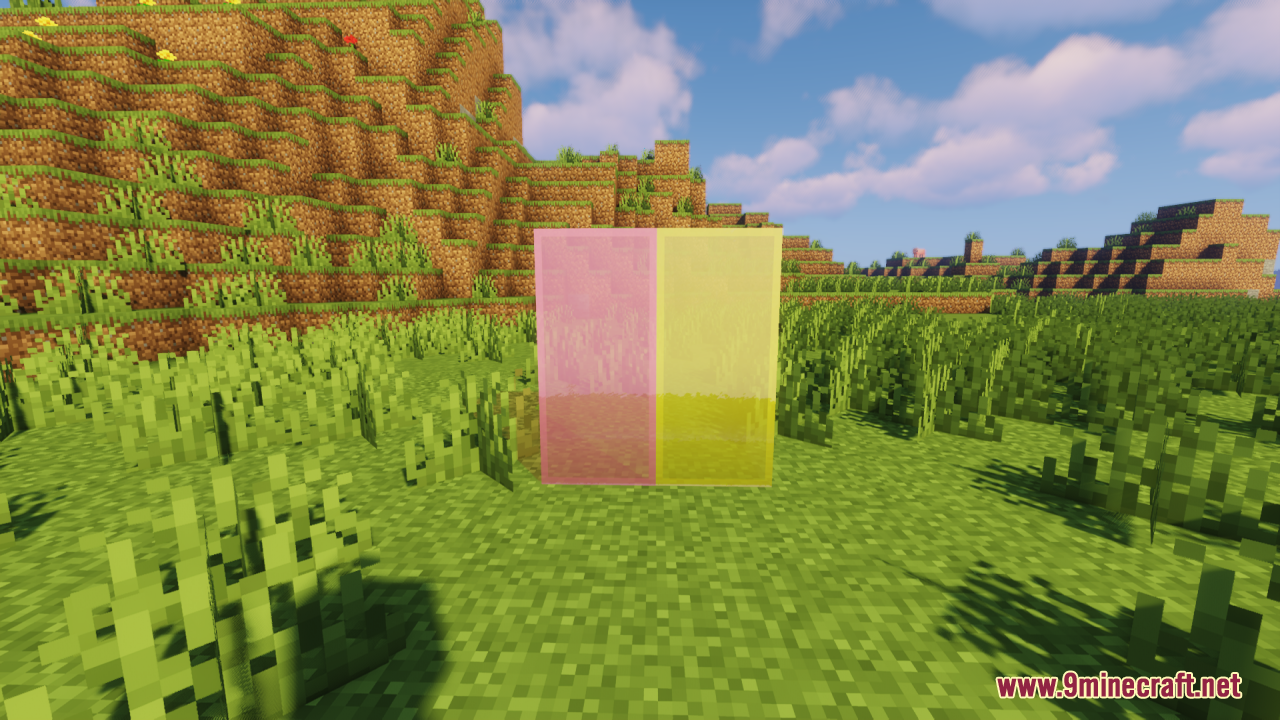 Perfect Clear Glass Resource Pack Screenshot 9 Pink and yellow clear stained glass blocks placed in a grassy field