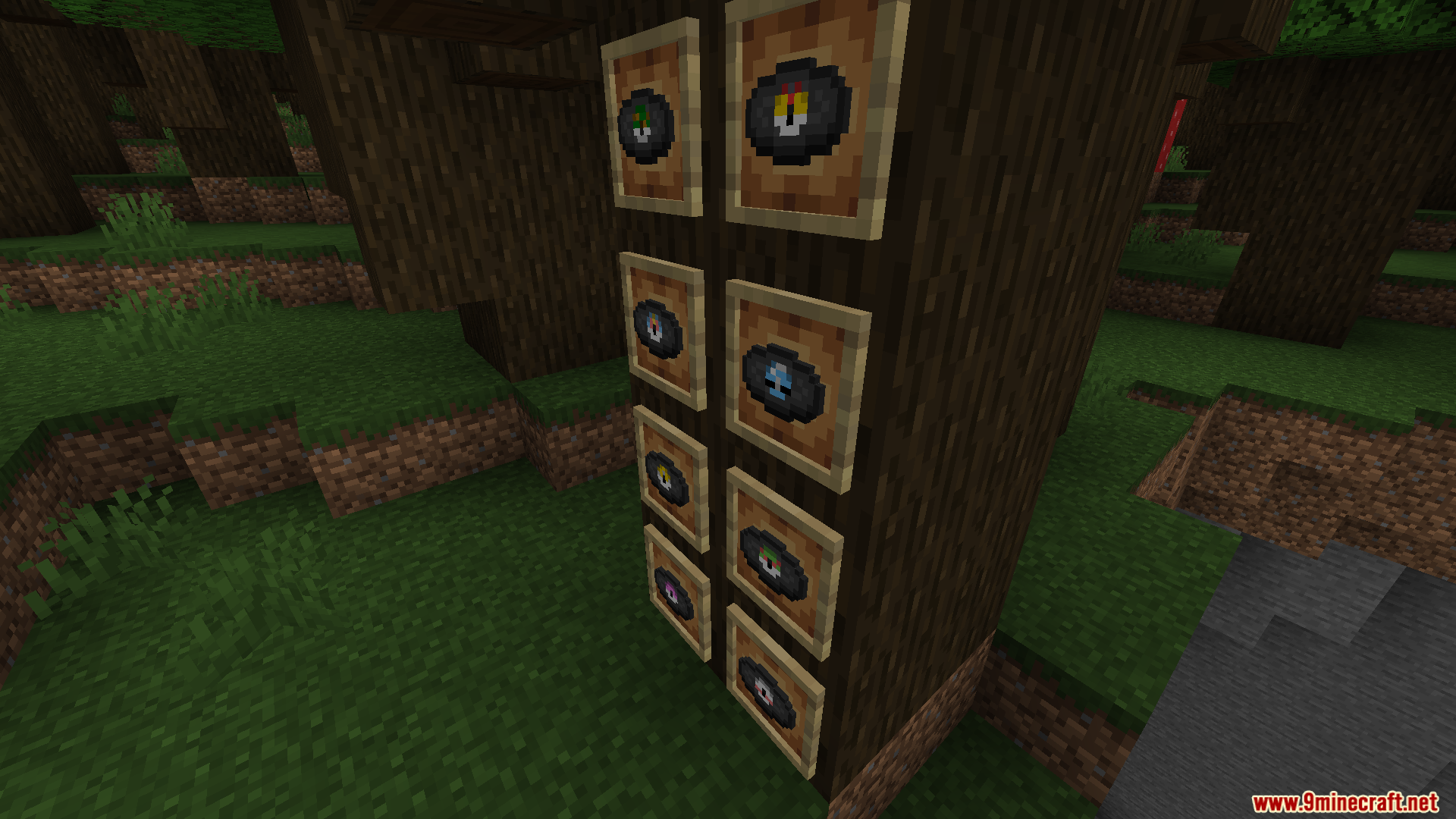 Poke Discs Resource Pack Screenshot 10 Several custom music discs displayed in item frames attached to a tree trunk