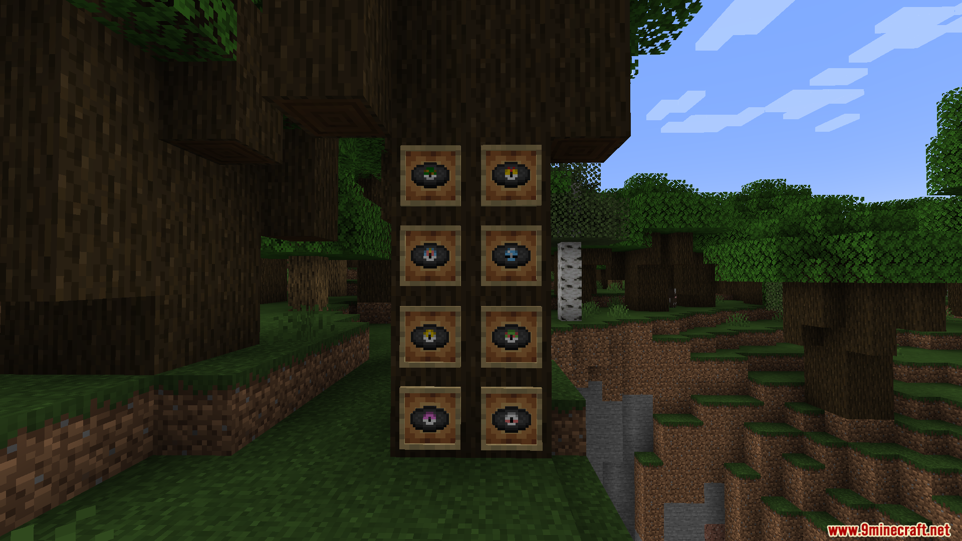 Poke Discs Resource Pack Screenshot 8 Multiple custom music records displayed inside item frames mounted on a tree trunk