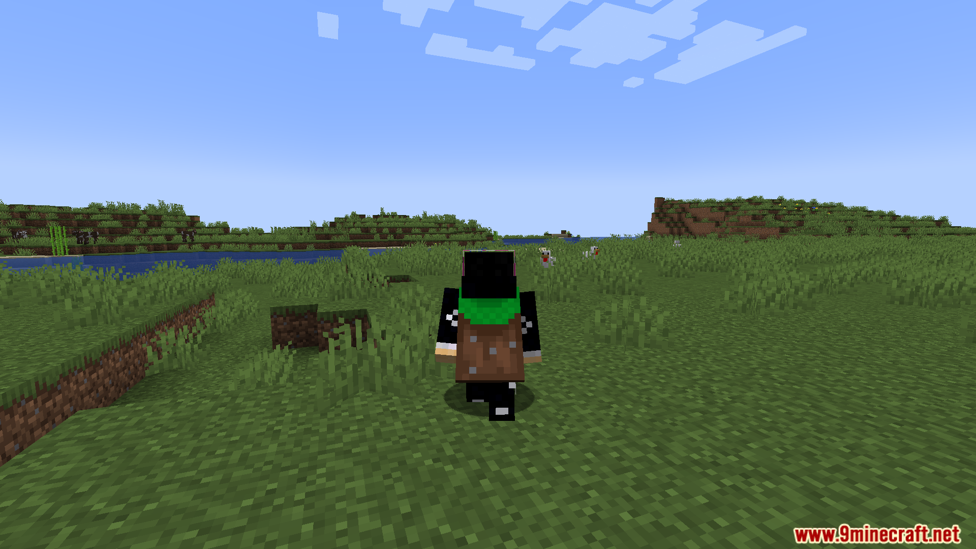 Player with a backpack walking across a green grassy field