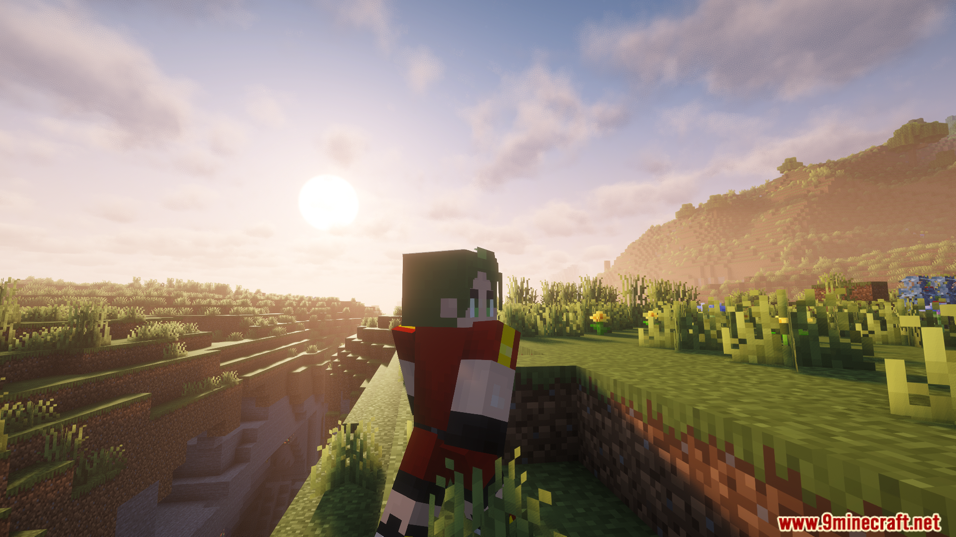 A Cobblemon trainer watches the sunrise over a hilly landscape