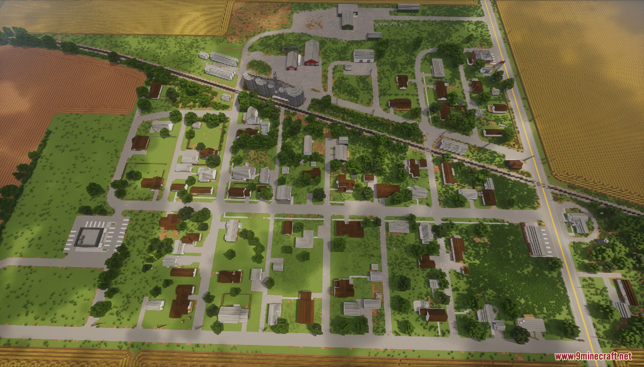 Aerial view of a small town with a railroad