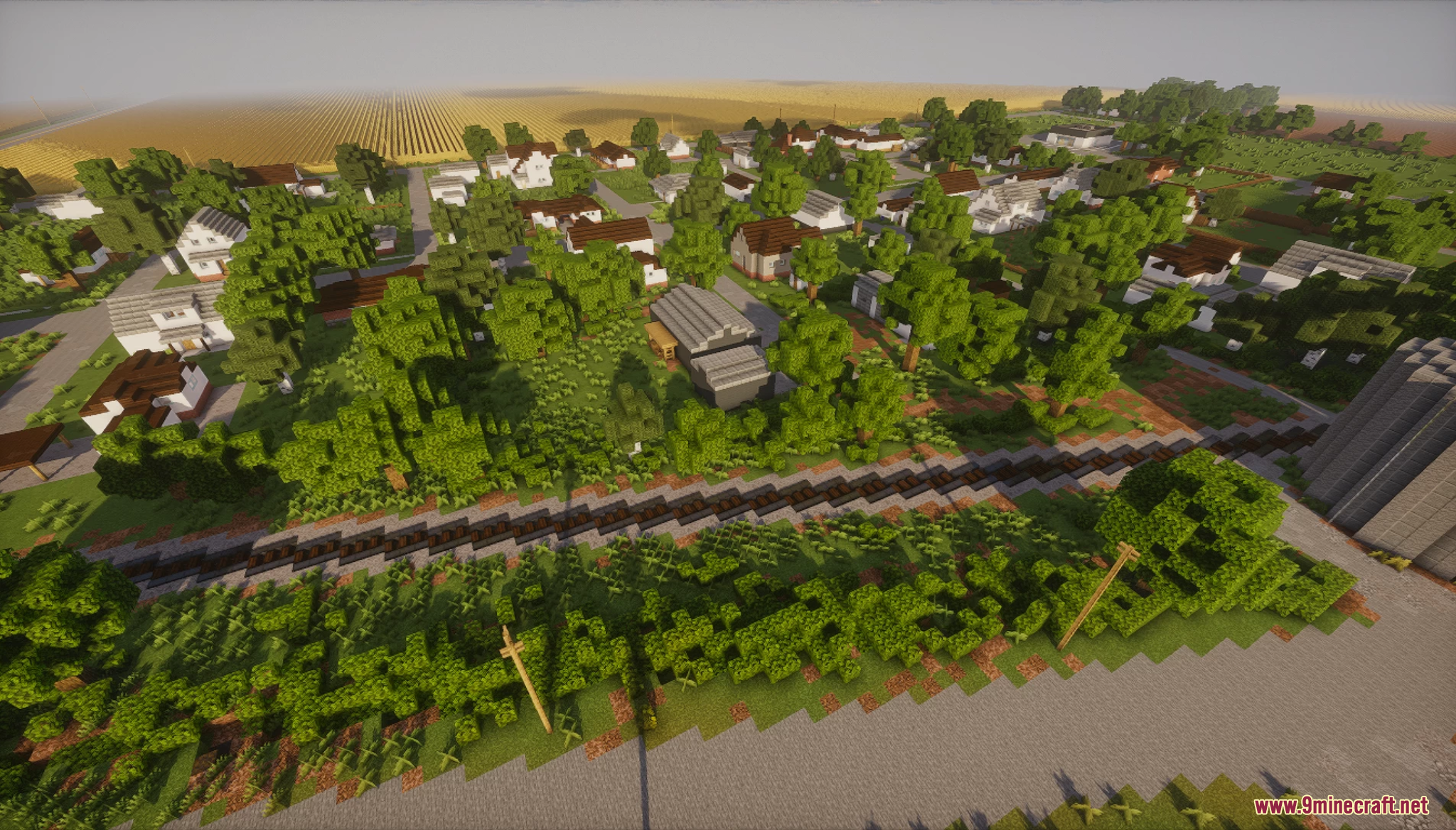 Railroad tracks cutting through a quiet suburban neighborhood