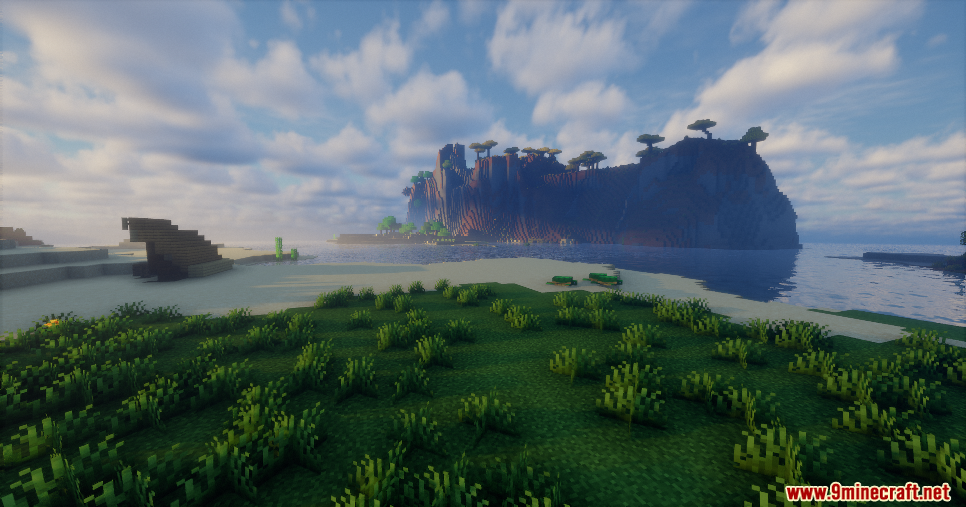 Rrtt217 S Hdr Mod Screenshot 7 A grassy shoreline looking out towards a large rocky island with trees