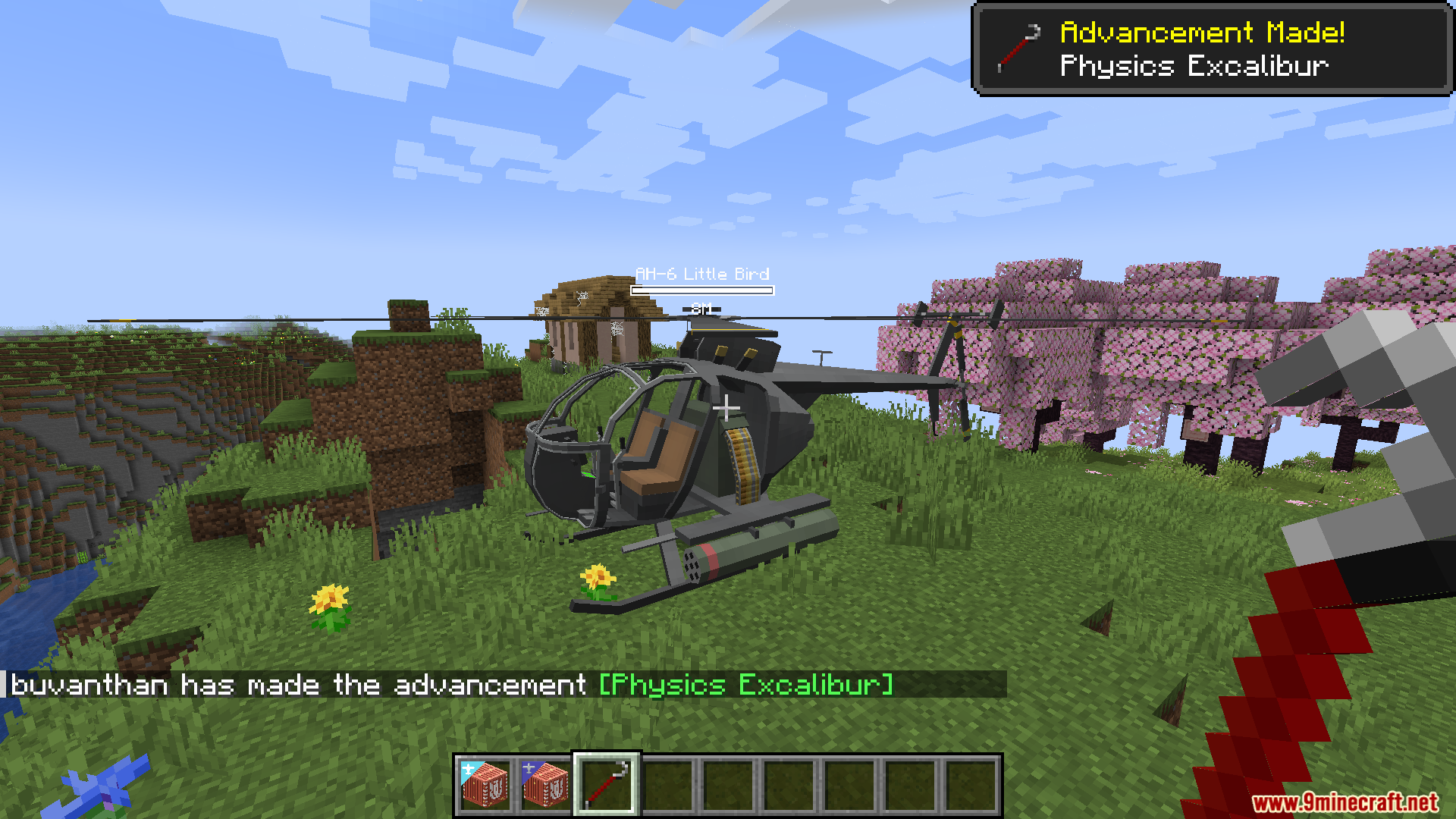 Player standing next to an AH-6 Little Bird helicopter