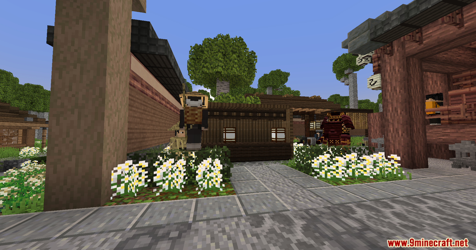 Sengoku Jidai Mod Screenshot 18 A player wearing a straw hat walks through a traditional Japanese village