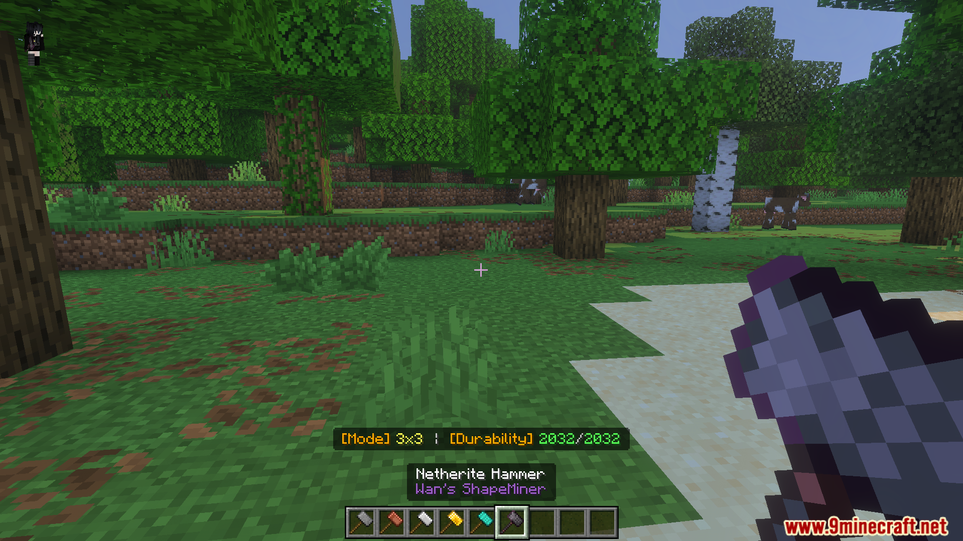 Player holding Netherite Hammer in forest showing mode and durability