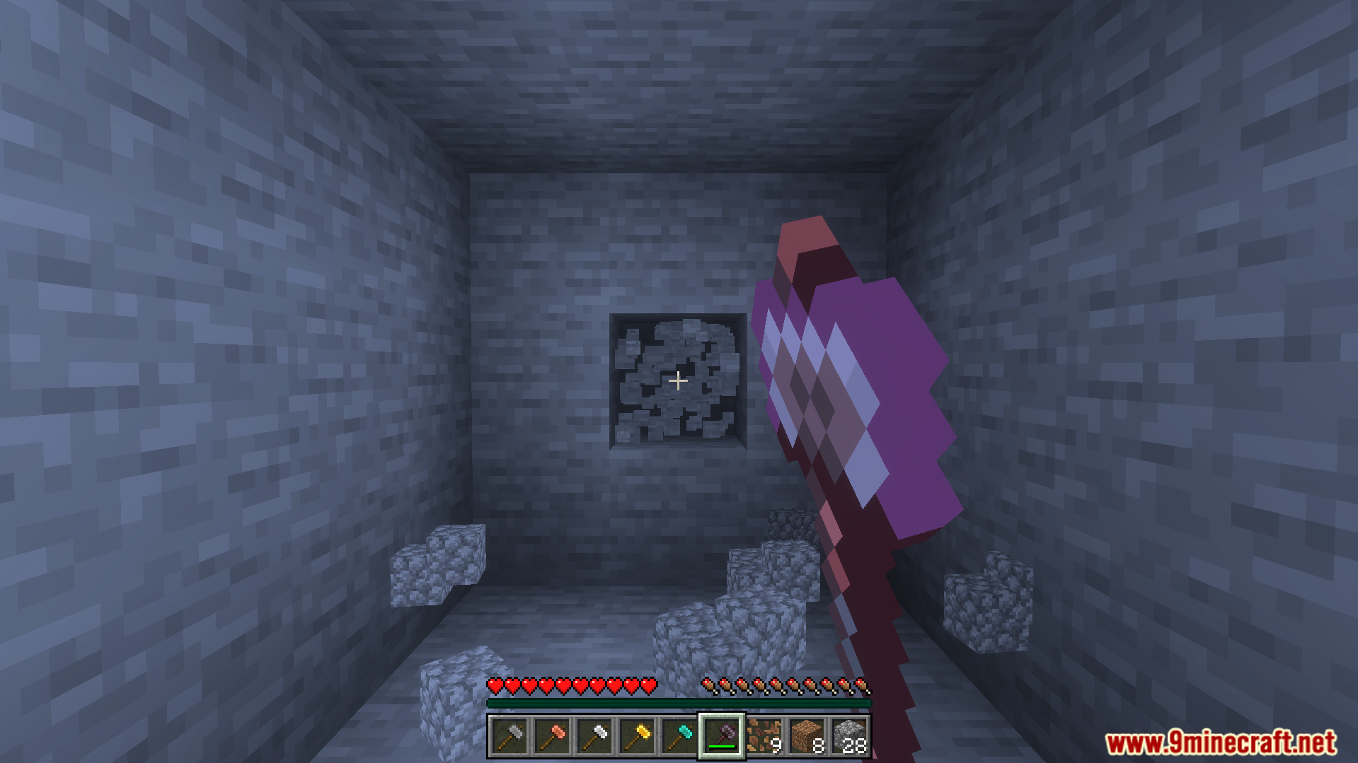 Simple Hammers Addon Screenshot 3 Player holding a new hammer tool facing a stone wall in cave