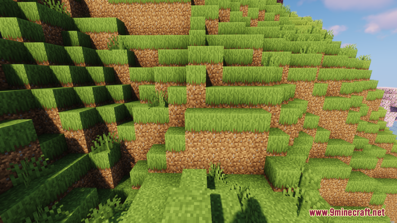 A terraced green hillside with lower grass textures