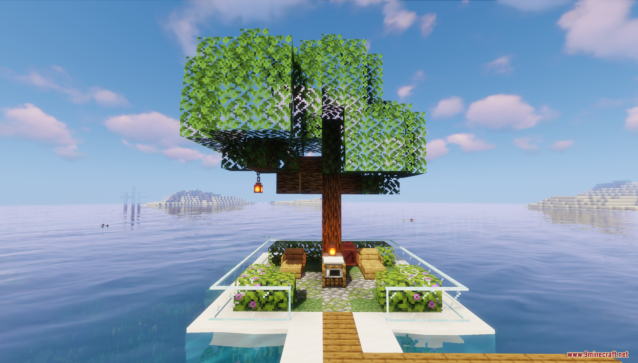 A large tree on a floating platform over the ocean