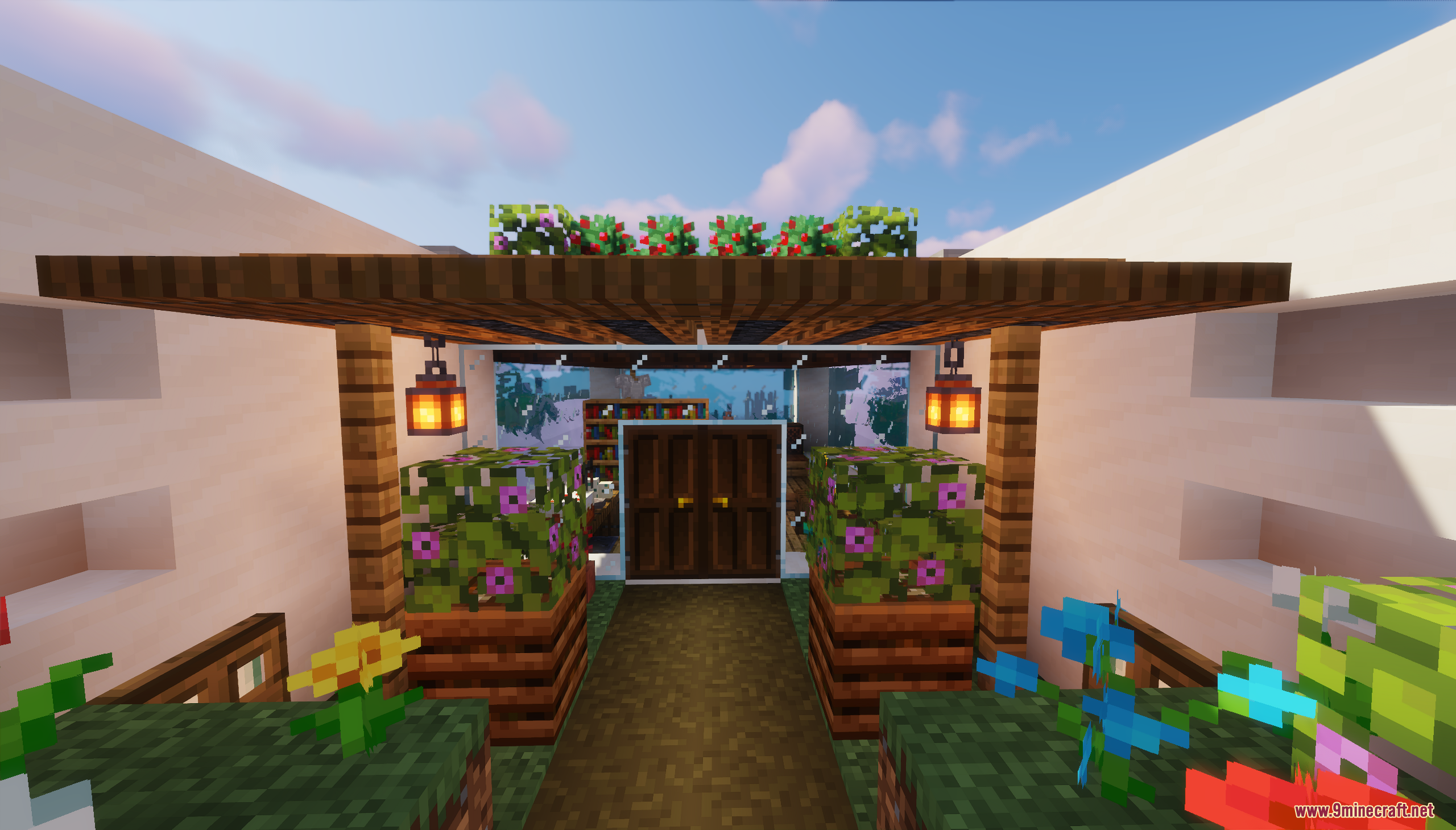 A decorated entrance with glass walls and double doors