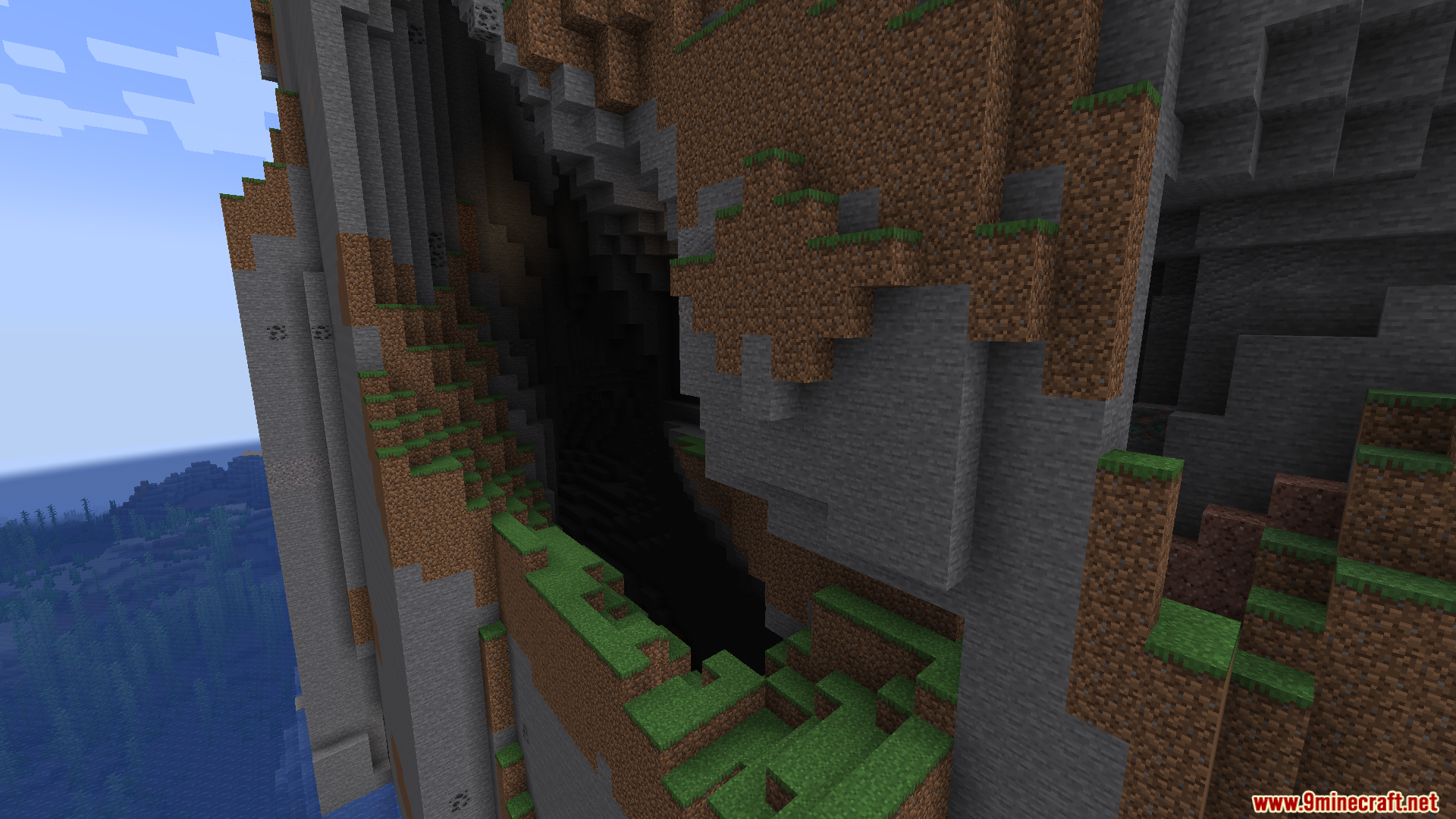 Starlight with Create Fix Mod Screenshot 3 A large dark cave opening in a steep Minecraft cliff face