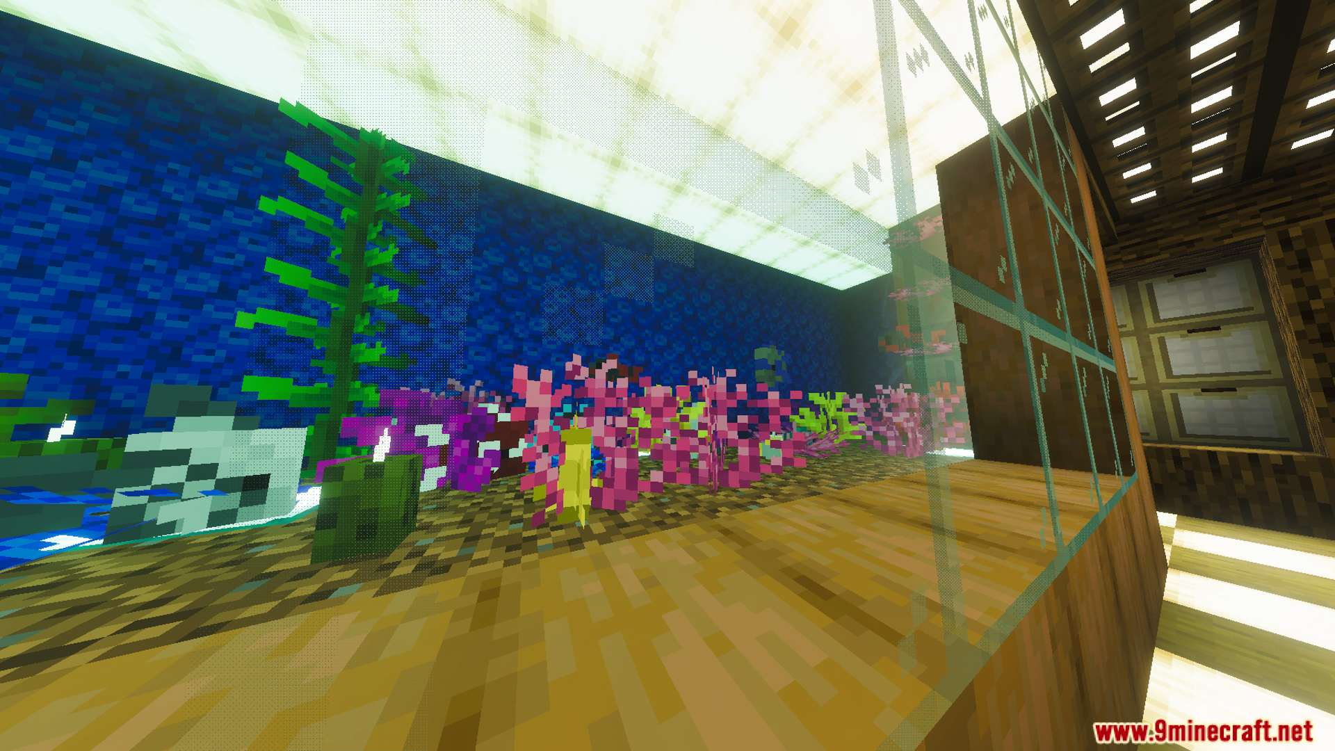 Beautiful dining room featuring a large aquarium with colorful coral and kelp